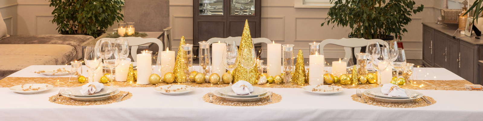 A table with plates and glasses on it.