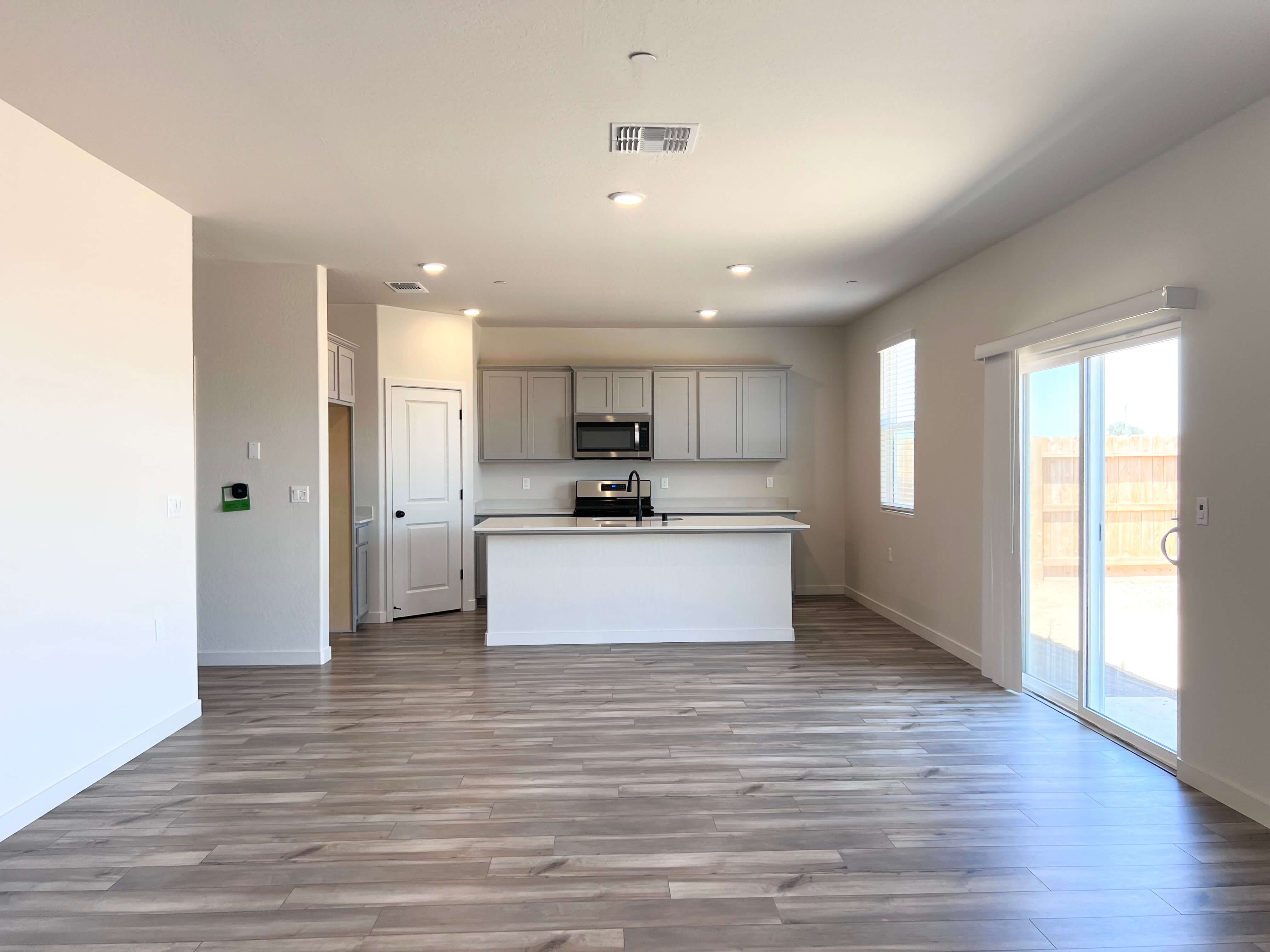A large kitchen with white cabinets.