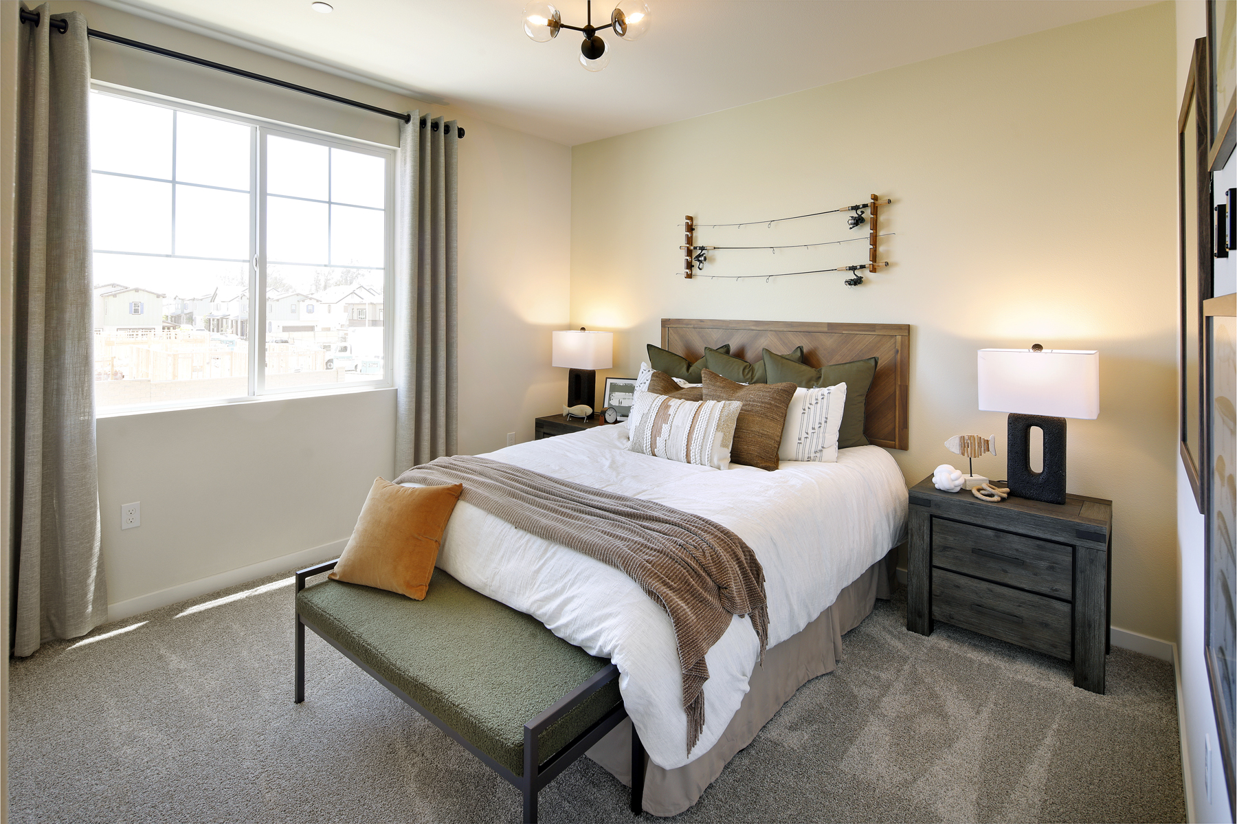 A bed with a white bed spread.