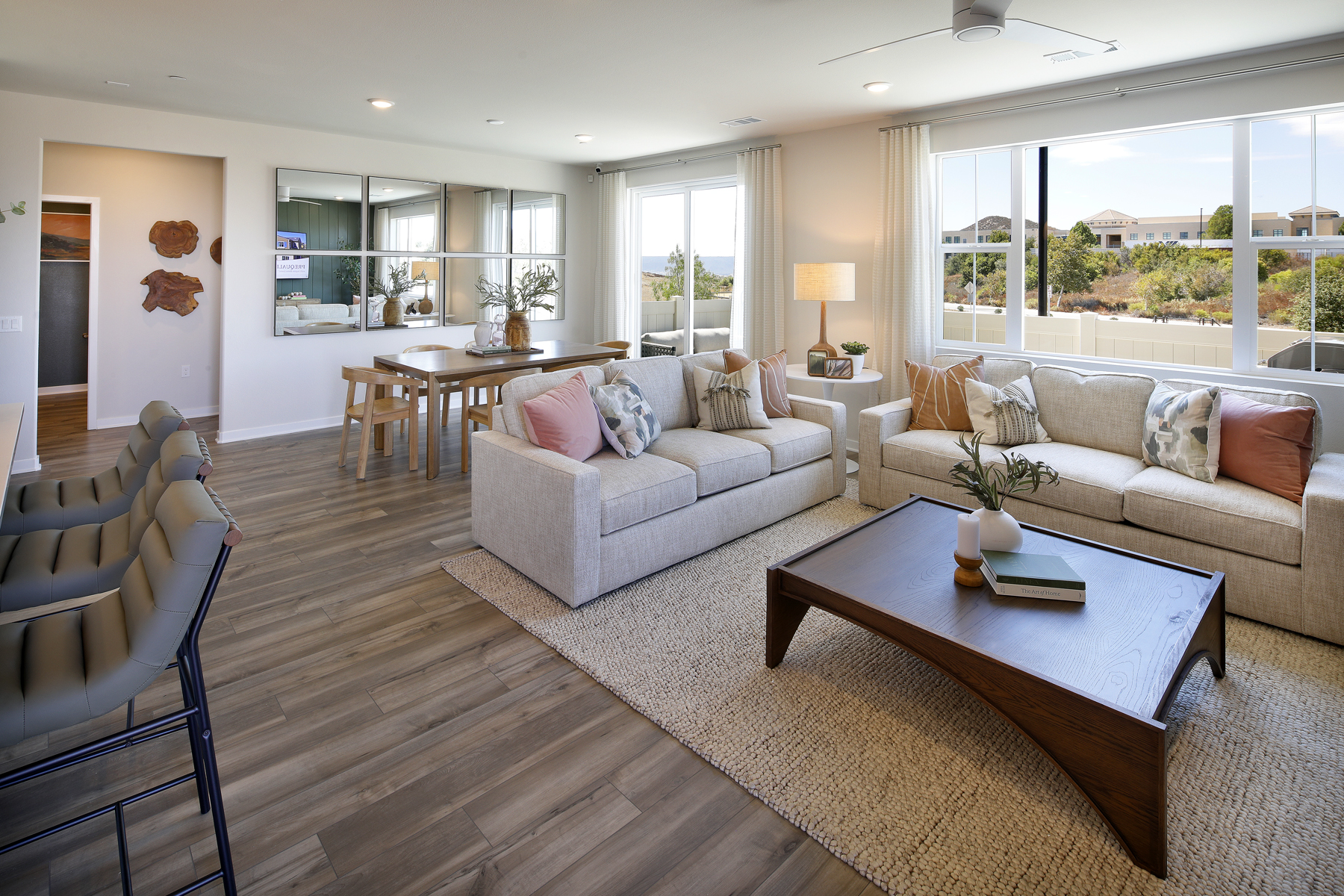 A living room with a wood floor.