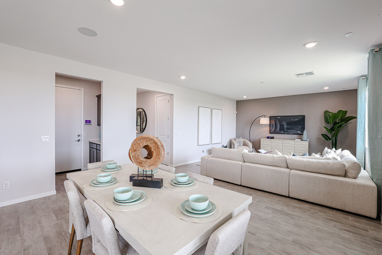 A living room with a couch and a table.