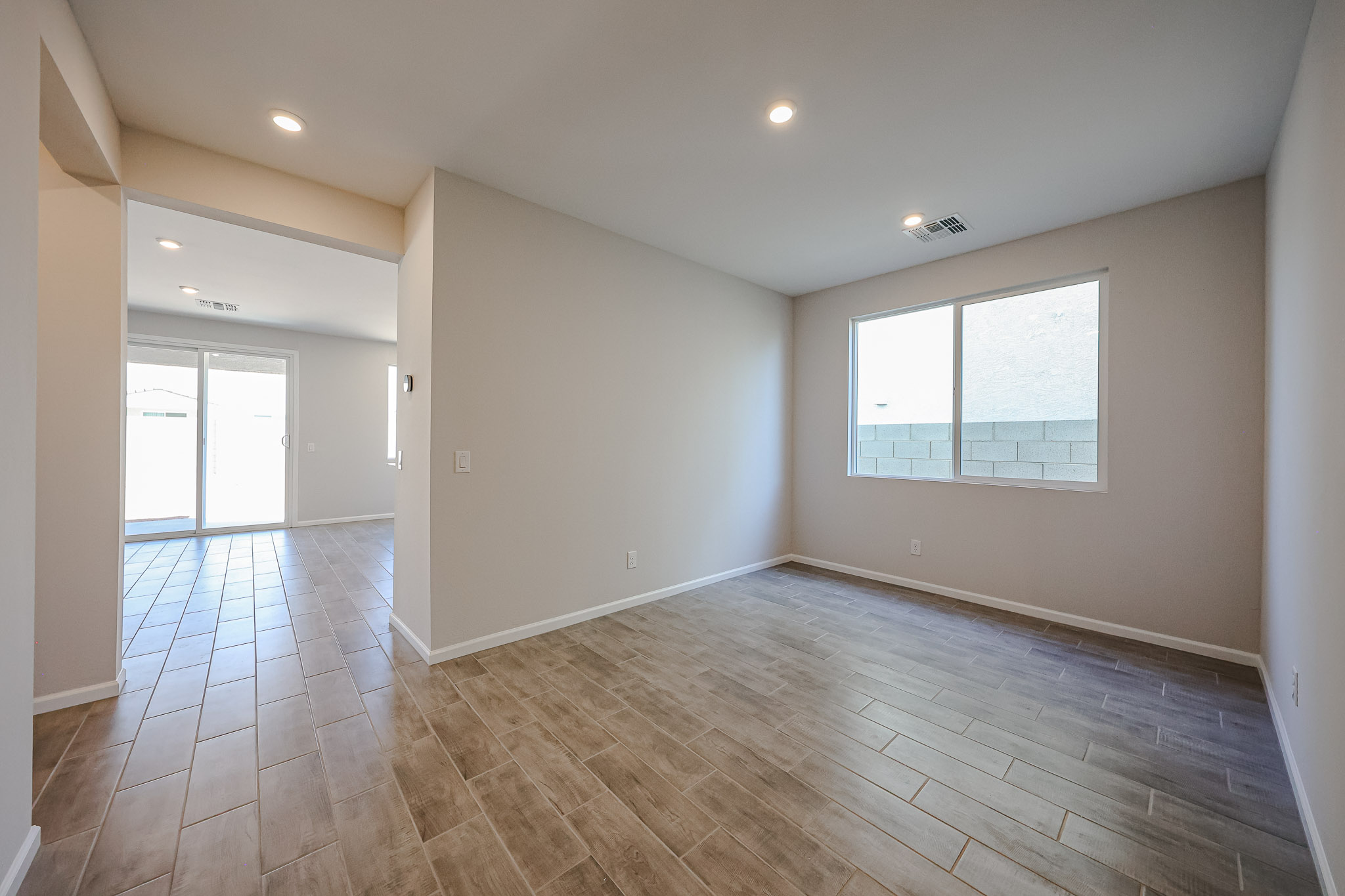 A room with a wood floor and a wood floor.
