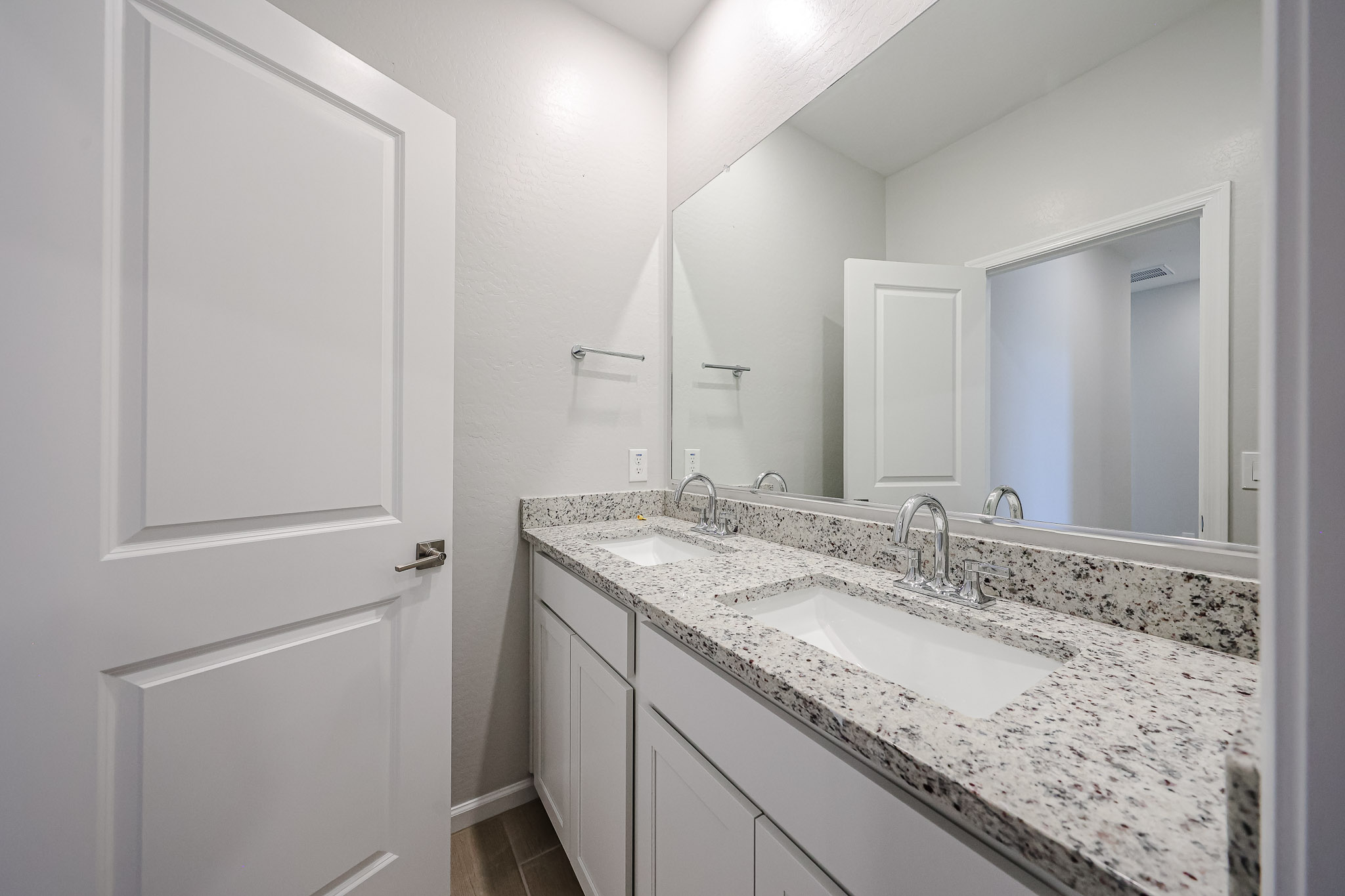 A bathroom with a marble countertop.