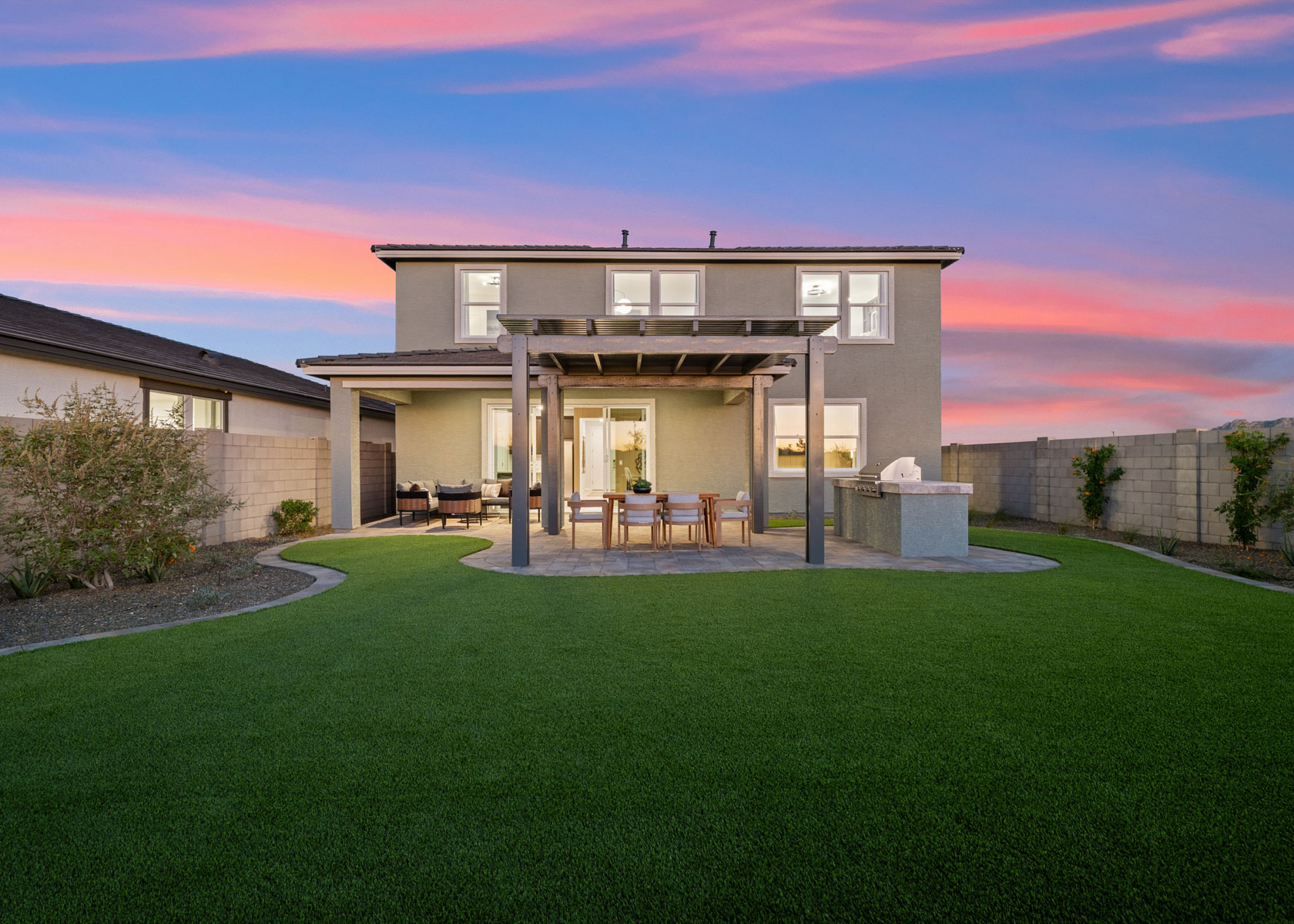 A house with a lawn and a large front yard.