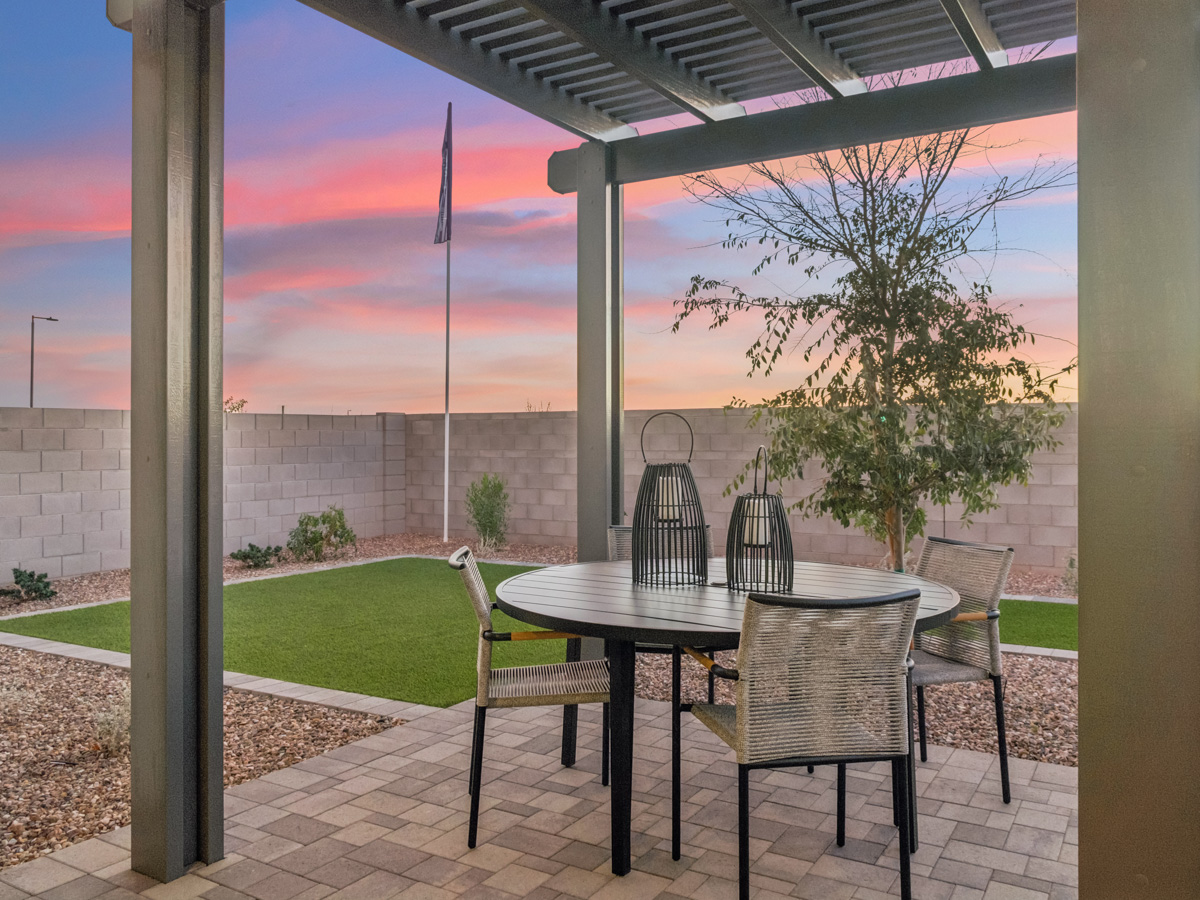 A table and chairs outside.
