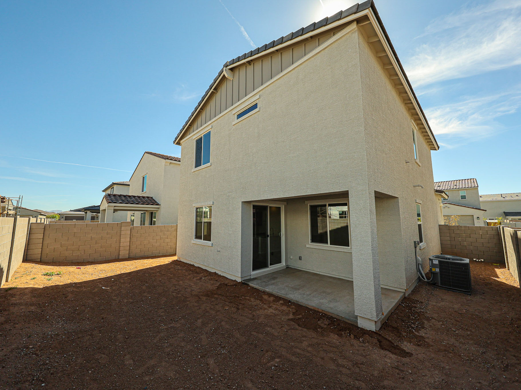 A white house with a blue sky.