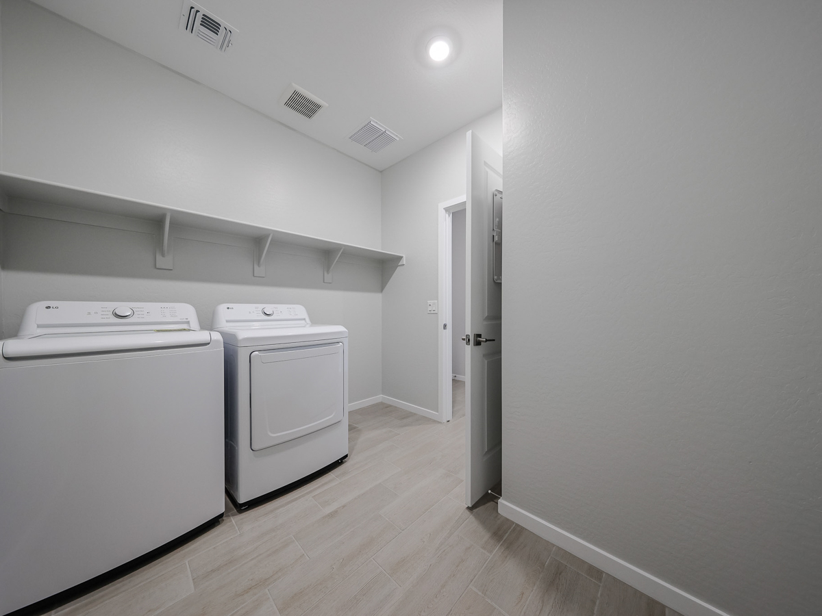 A room with white appliances.