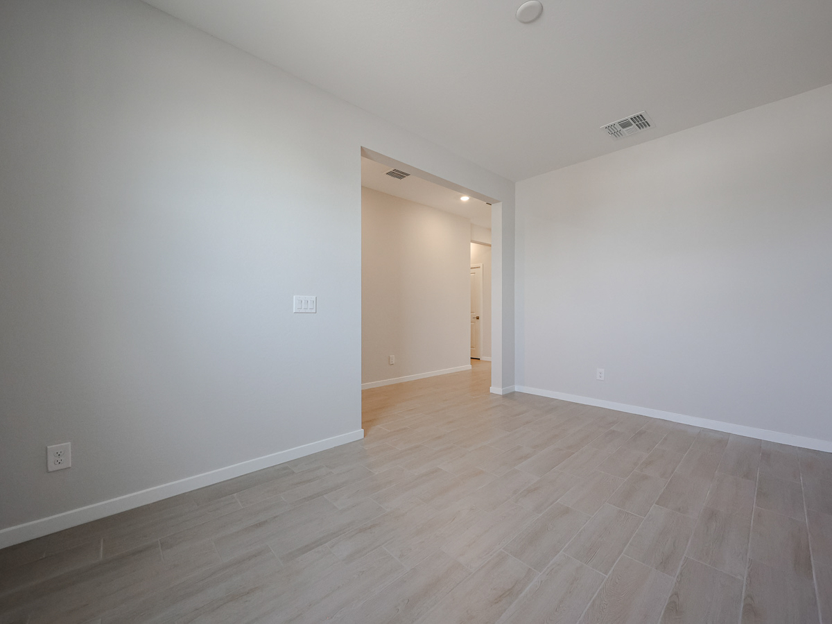 A room with a wood floor and a wood floor.