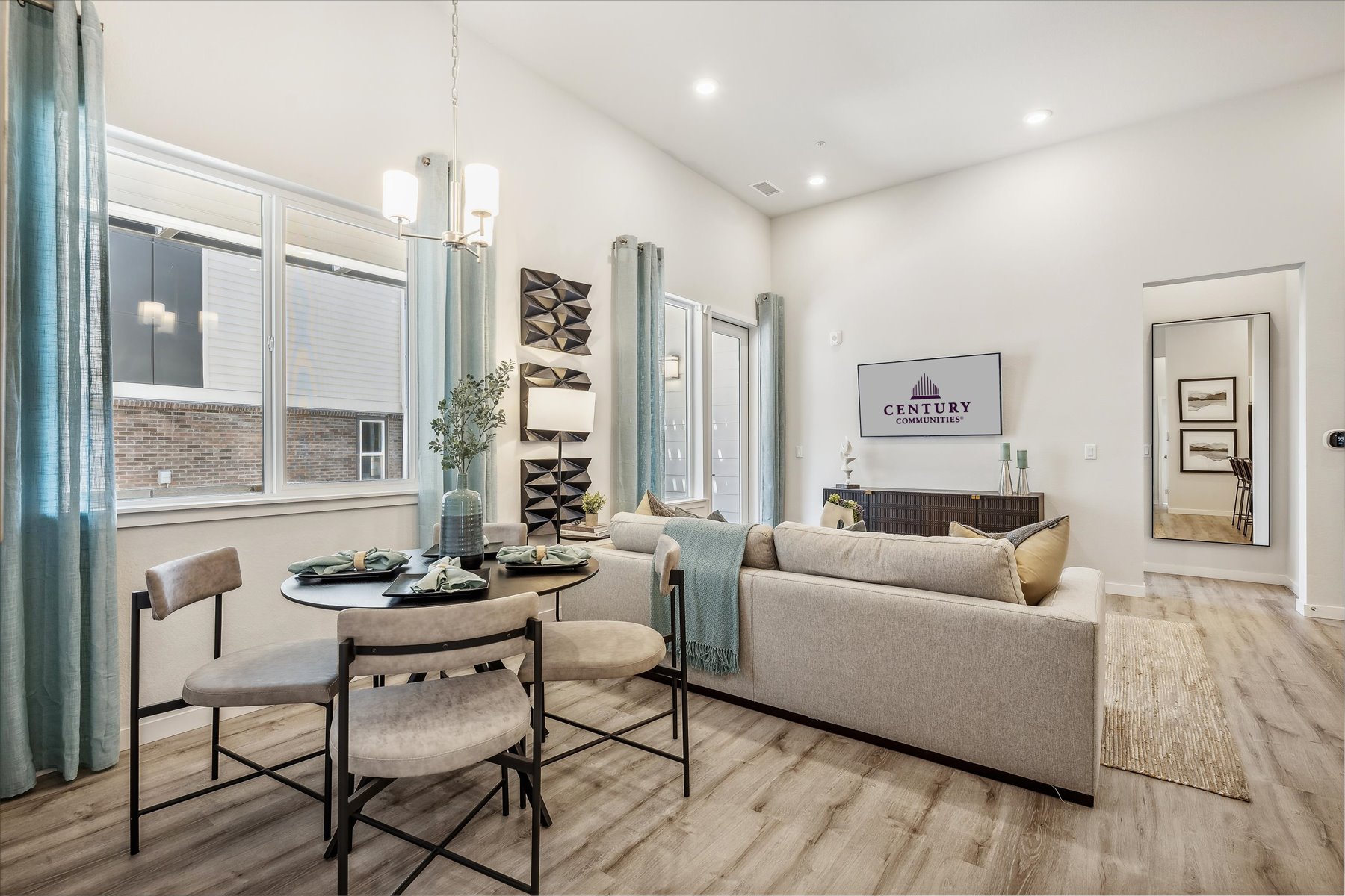 A living room with a couch and a table.