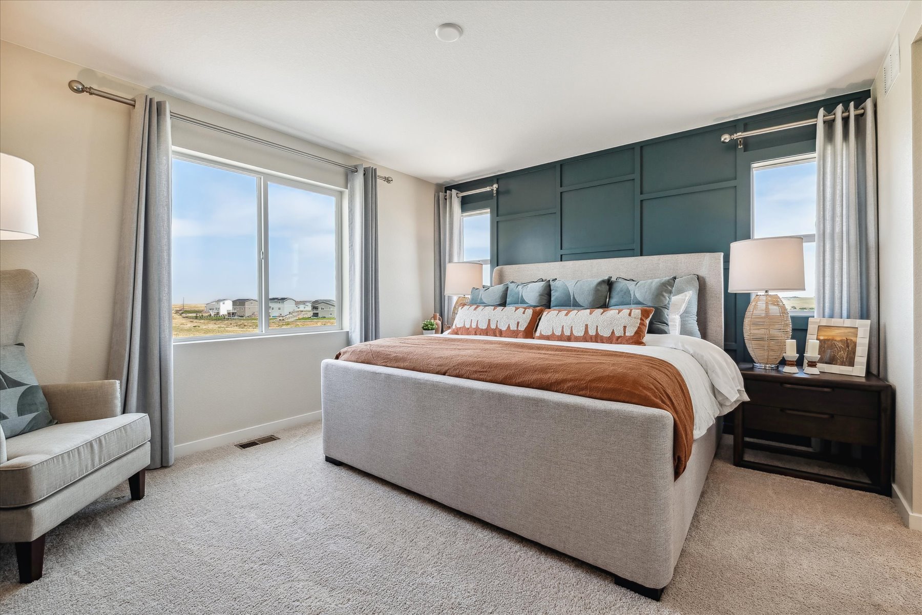 A bedroom with a bed and a couch.