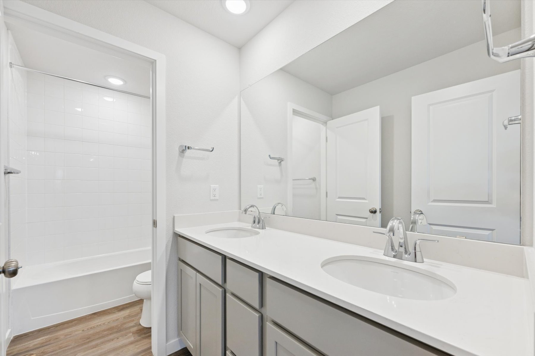 A bathroom with a sink and a toilet.