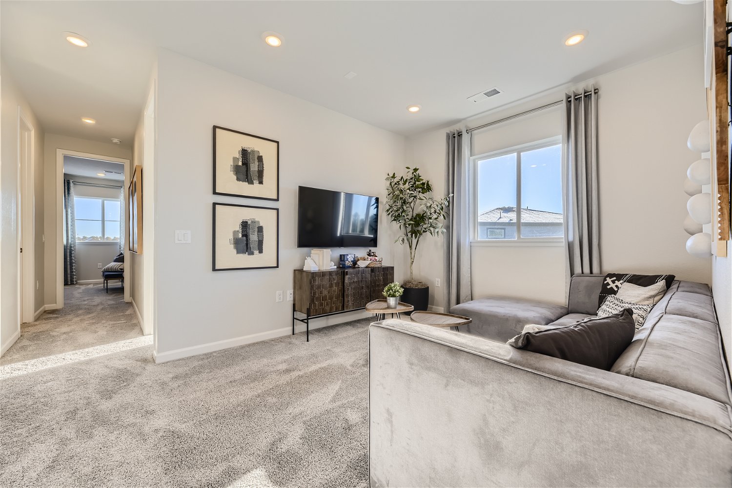 A living room with a tv and couches.