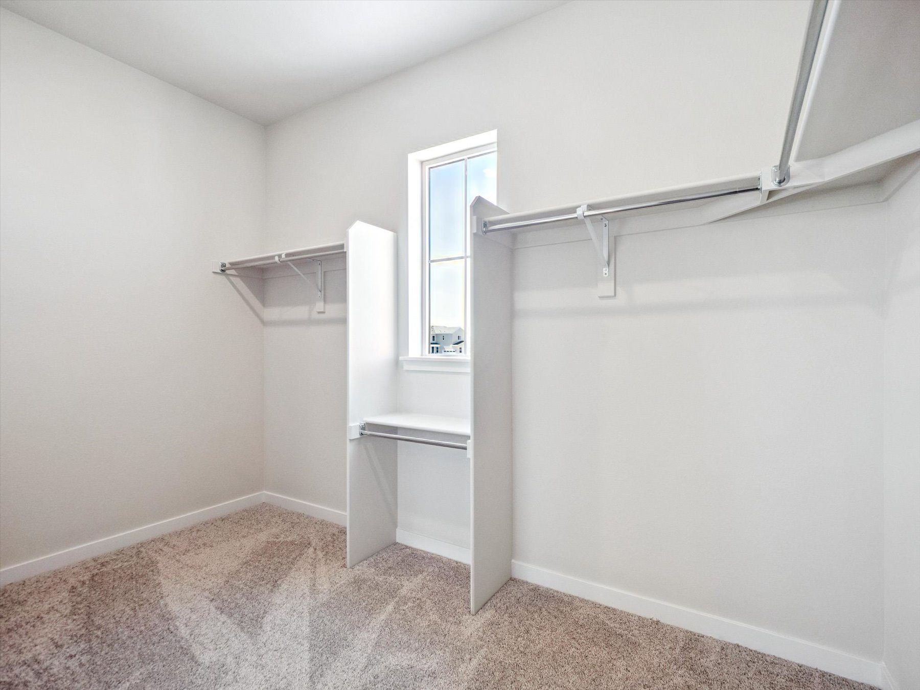 A white room with a window.