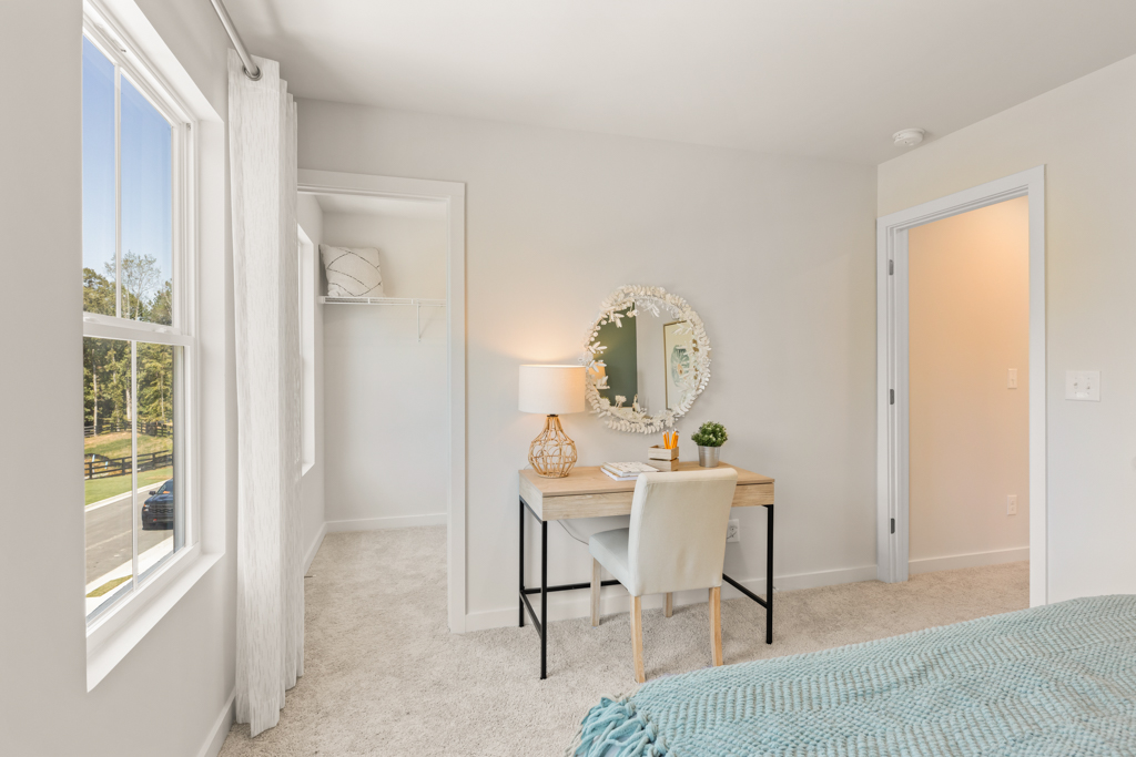 A room with a table and a mirror.