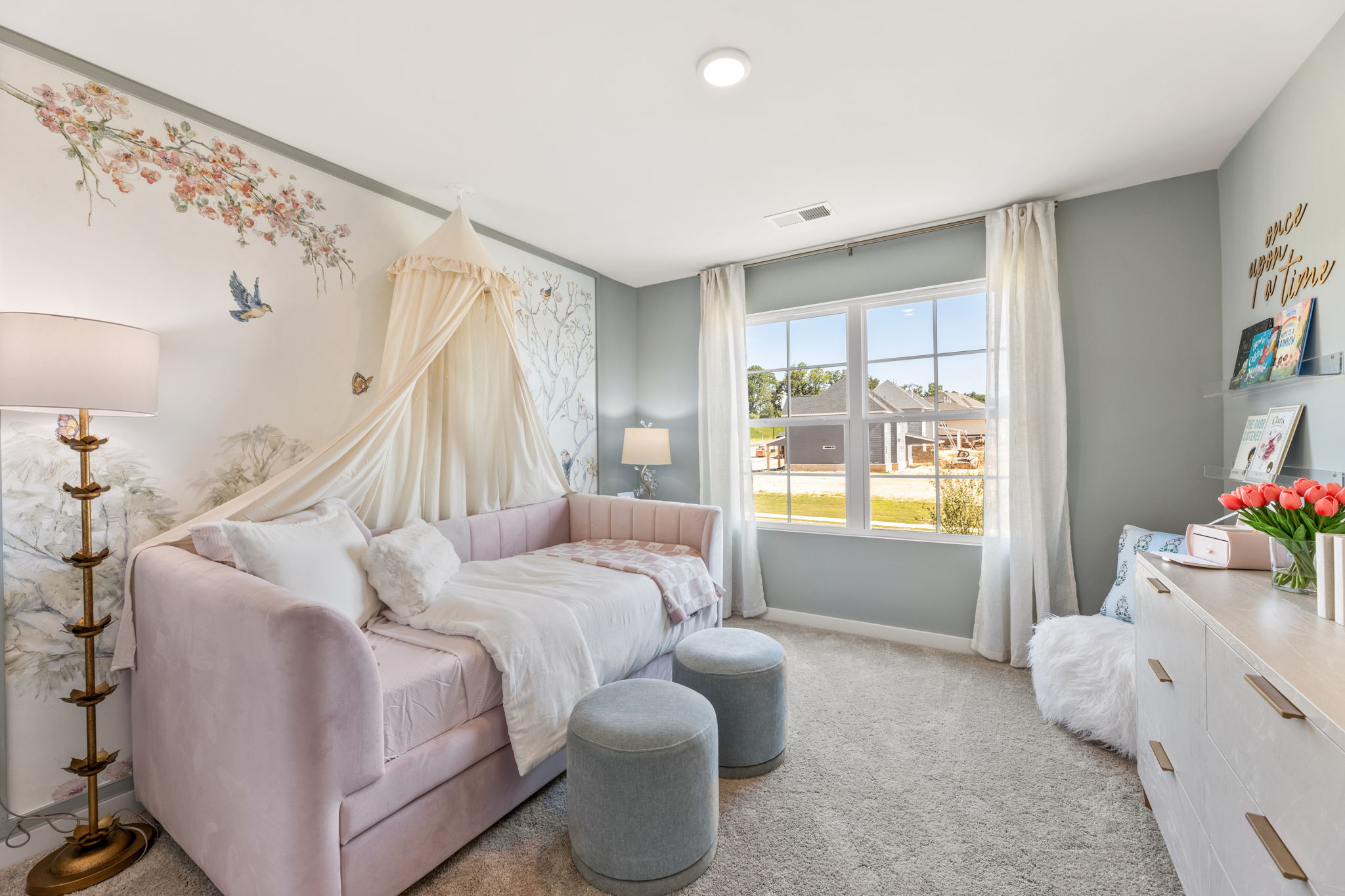 A bedroom with a bed and a couch.