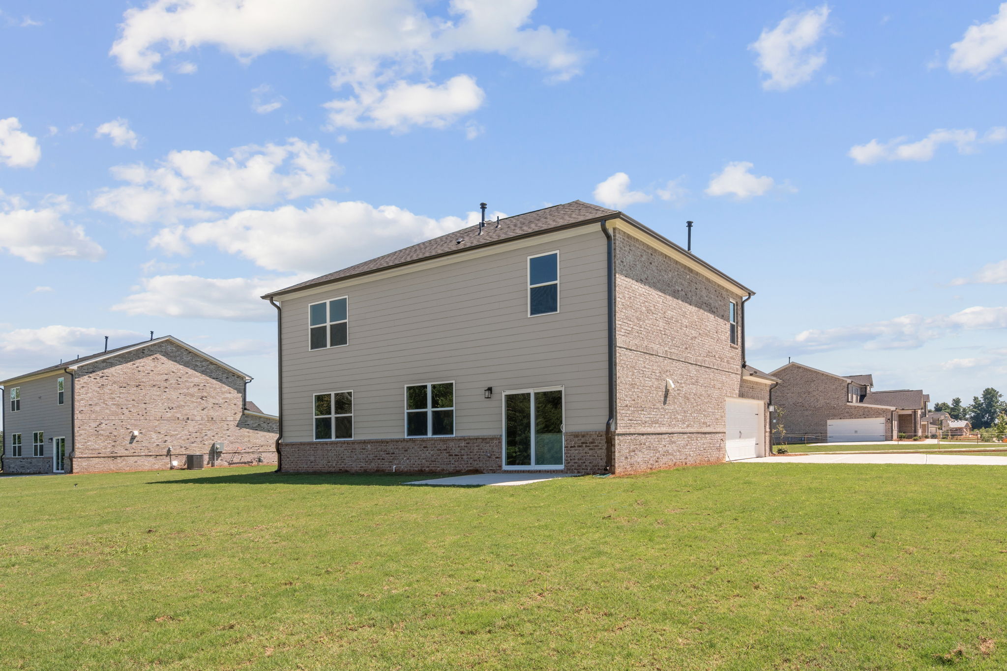 A building with a grass field.