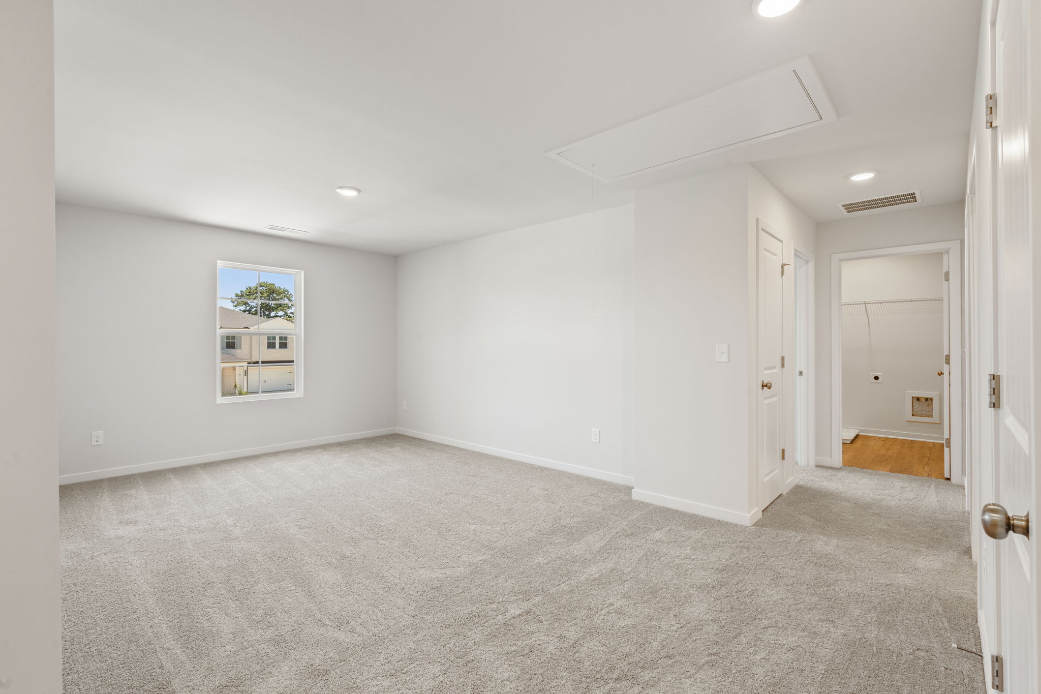 A hallway with white doors.