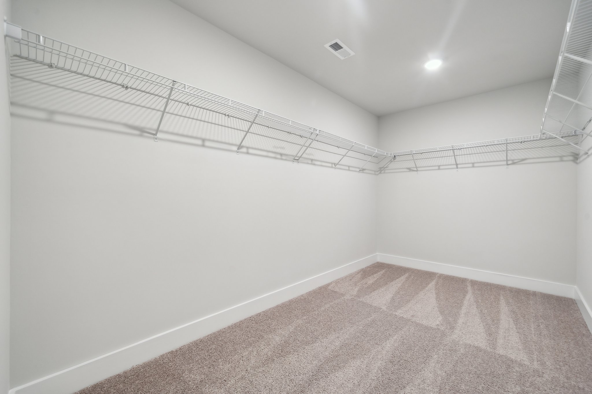A white room with a tile floor.