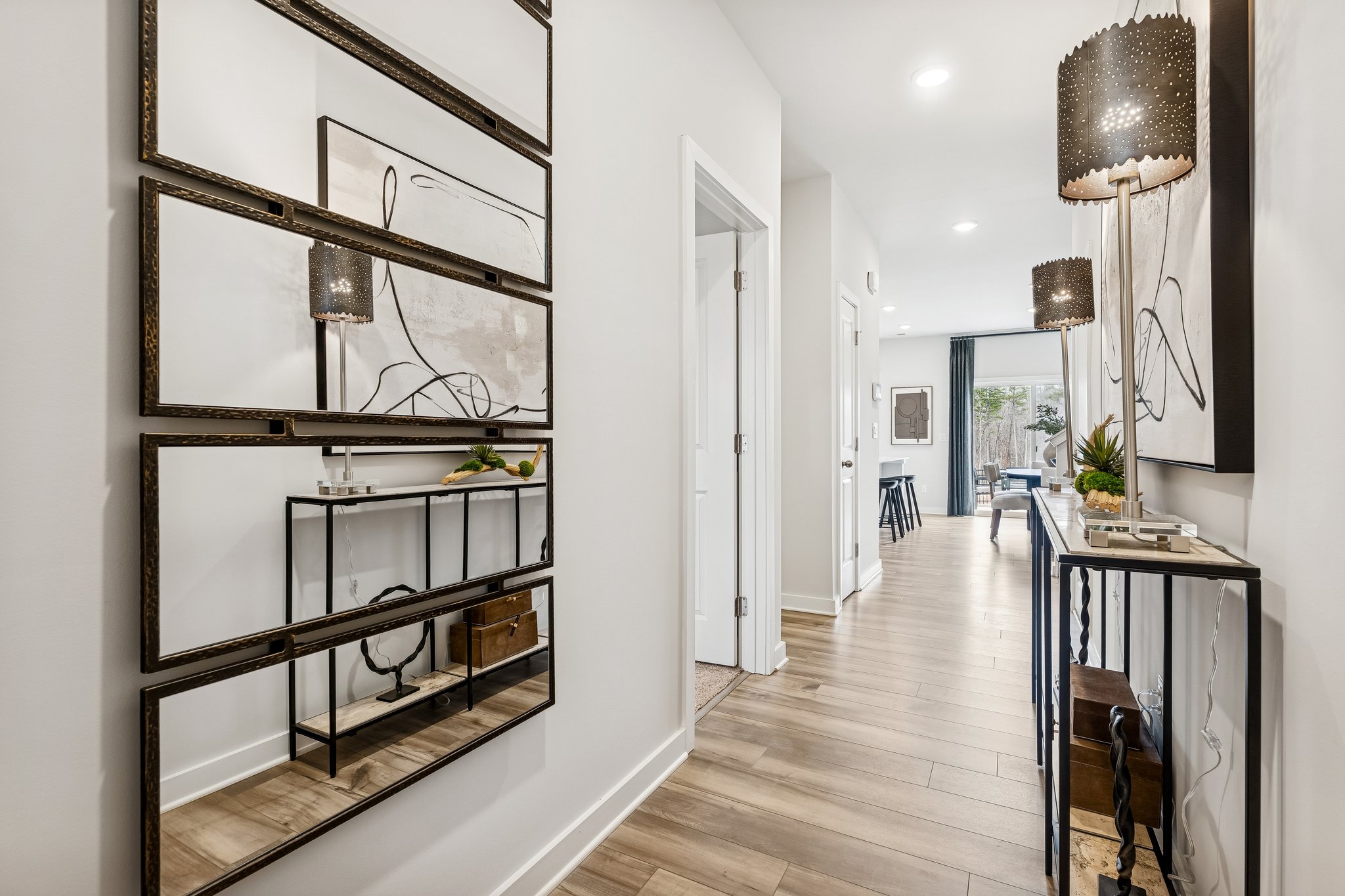 A room with a wood floor and a wood floor with a white wall.