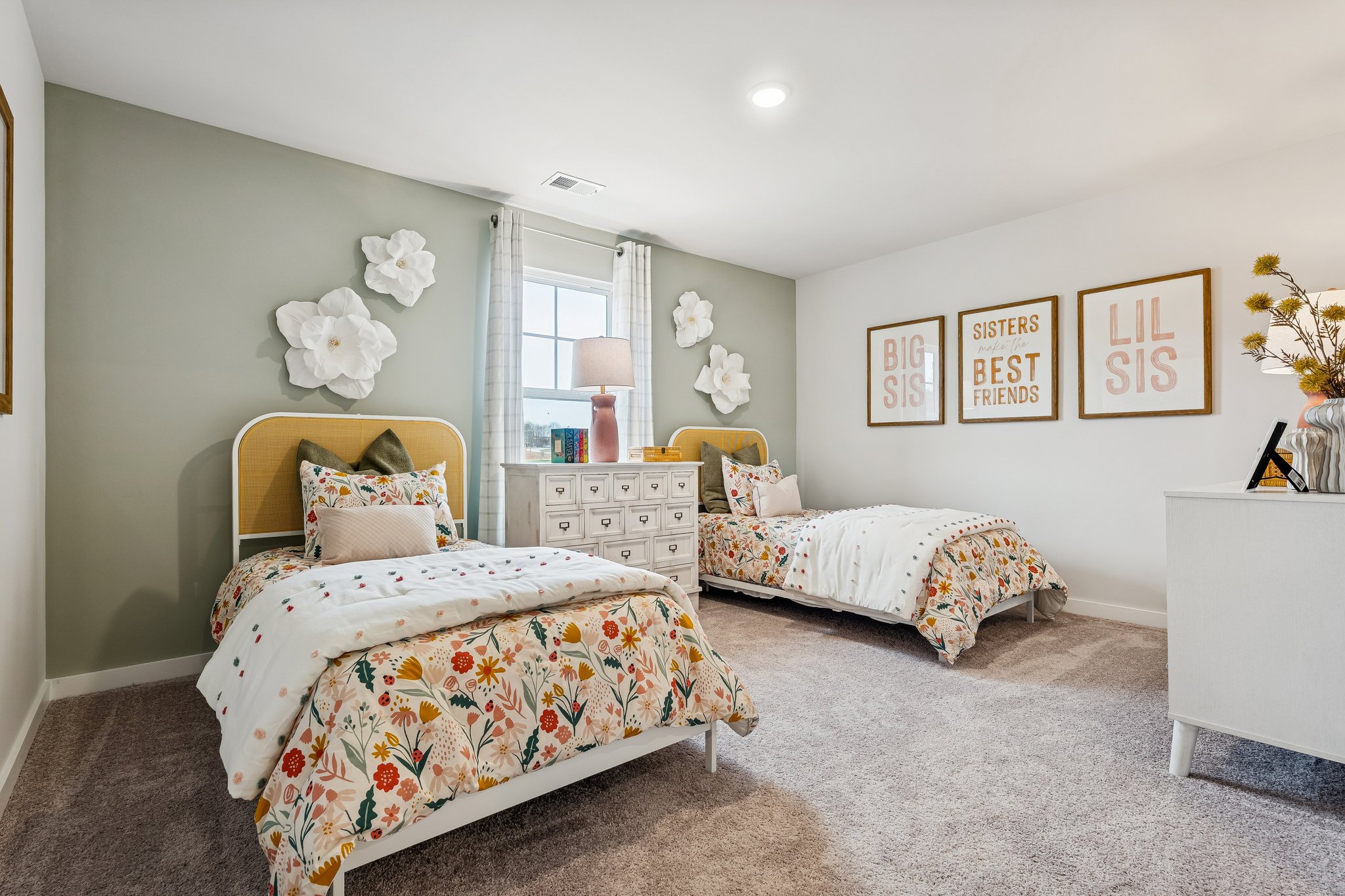 A bedroom with two beds.