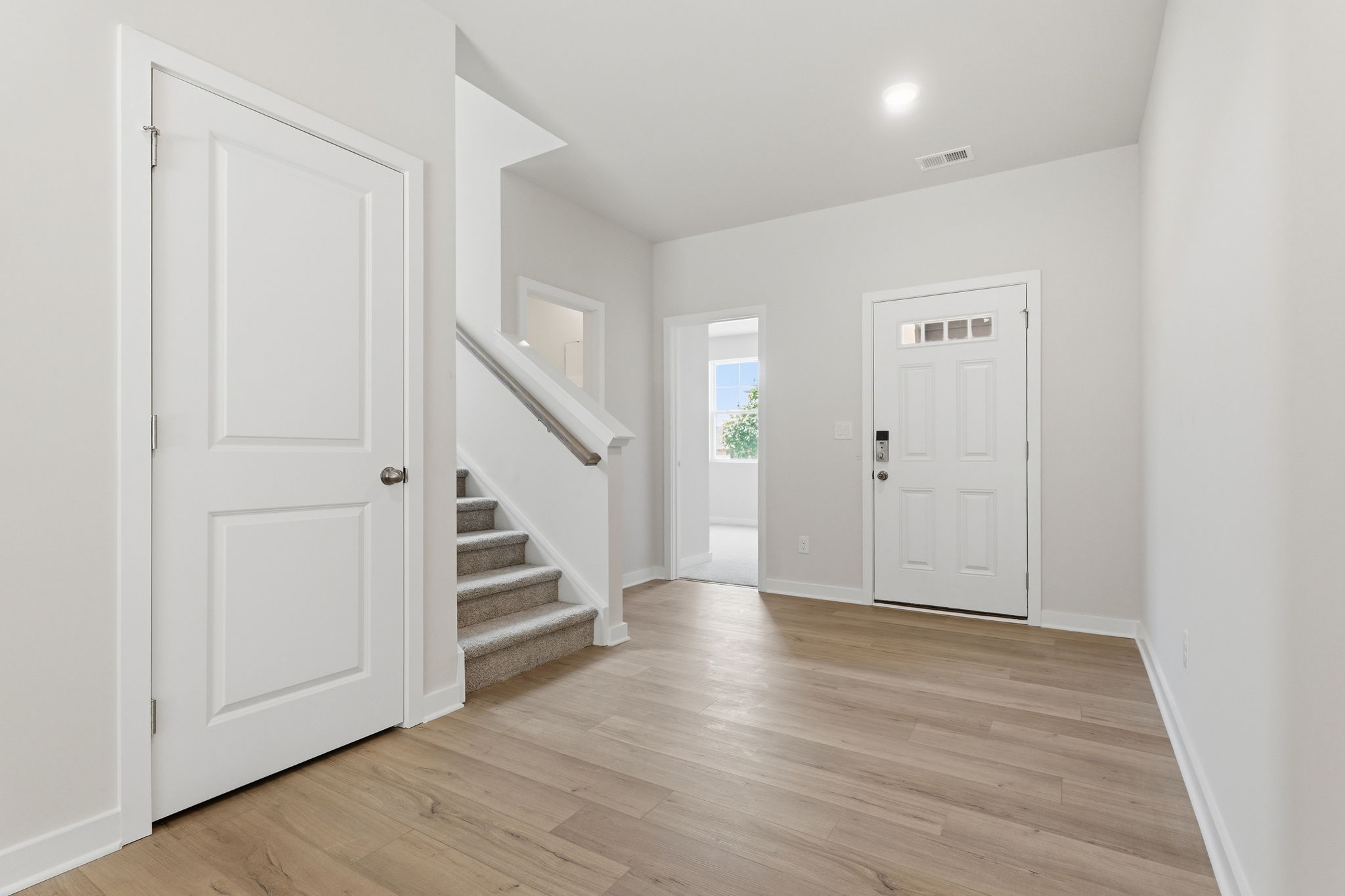 A hallway with white doors.