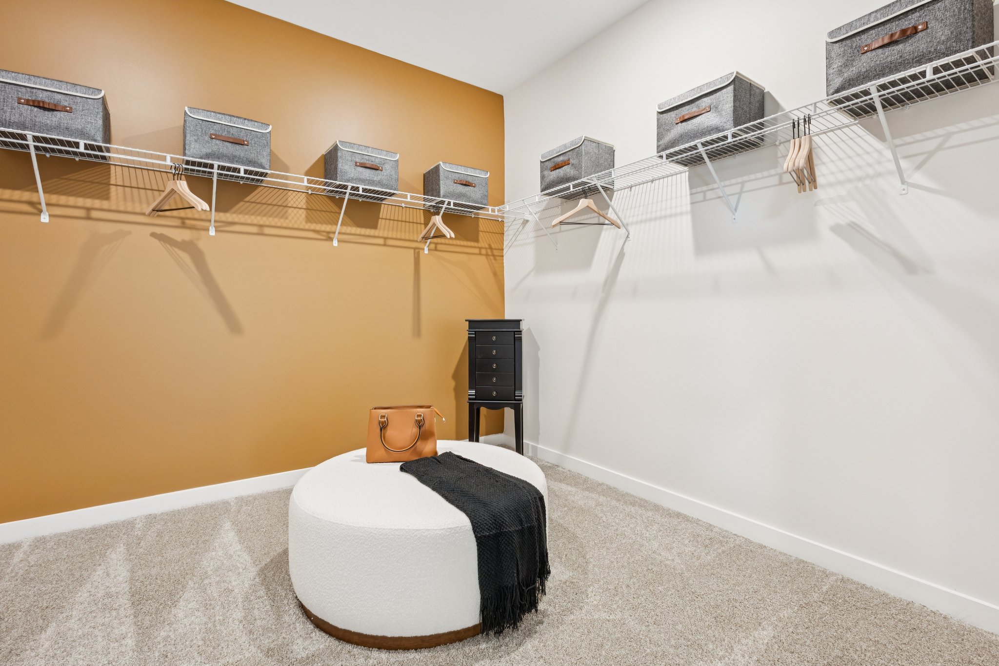 A room with a bed and a chair.