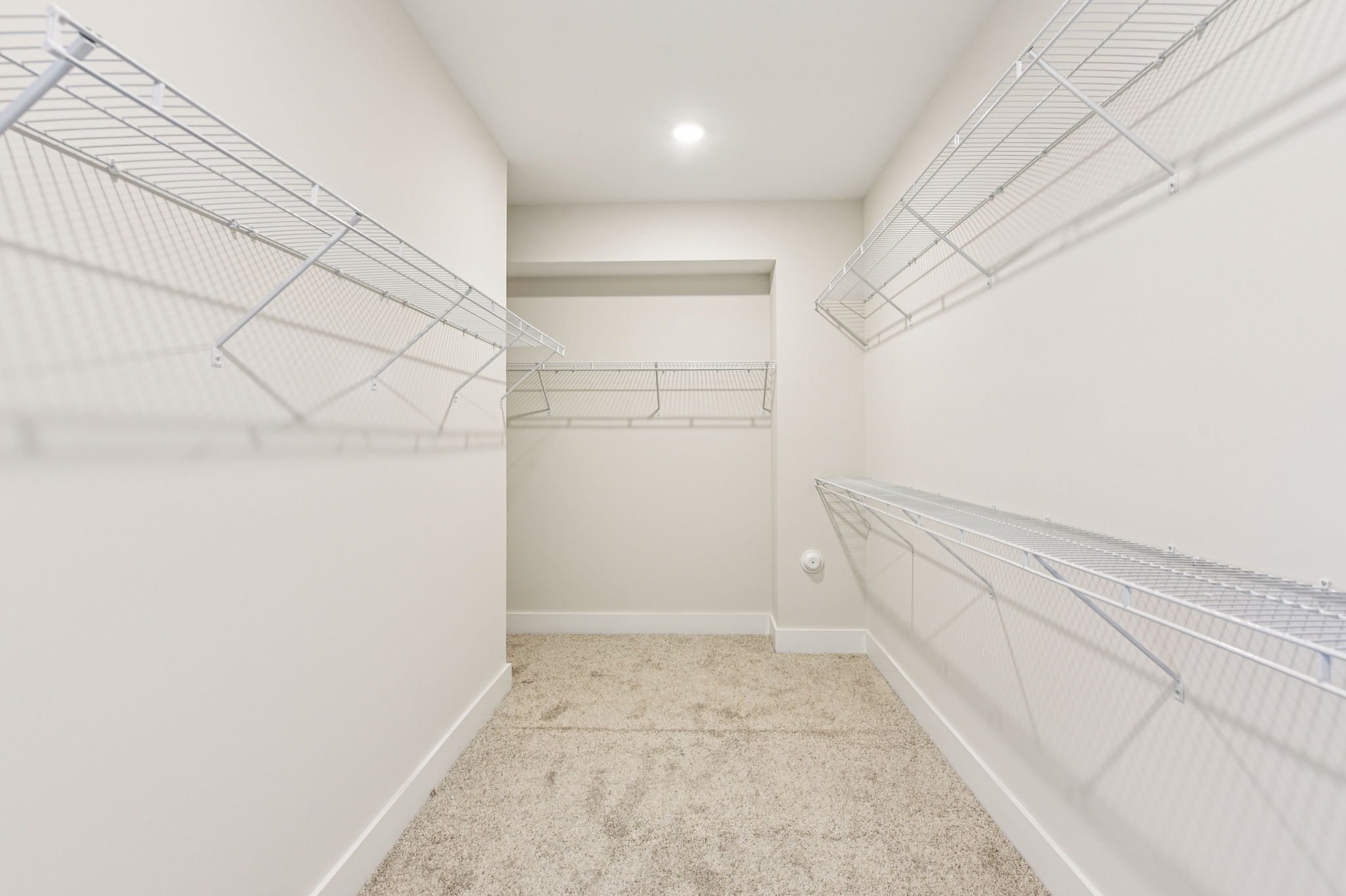A white hallway with white walls.