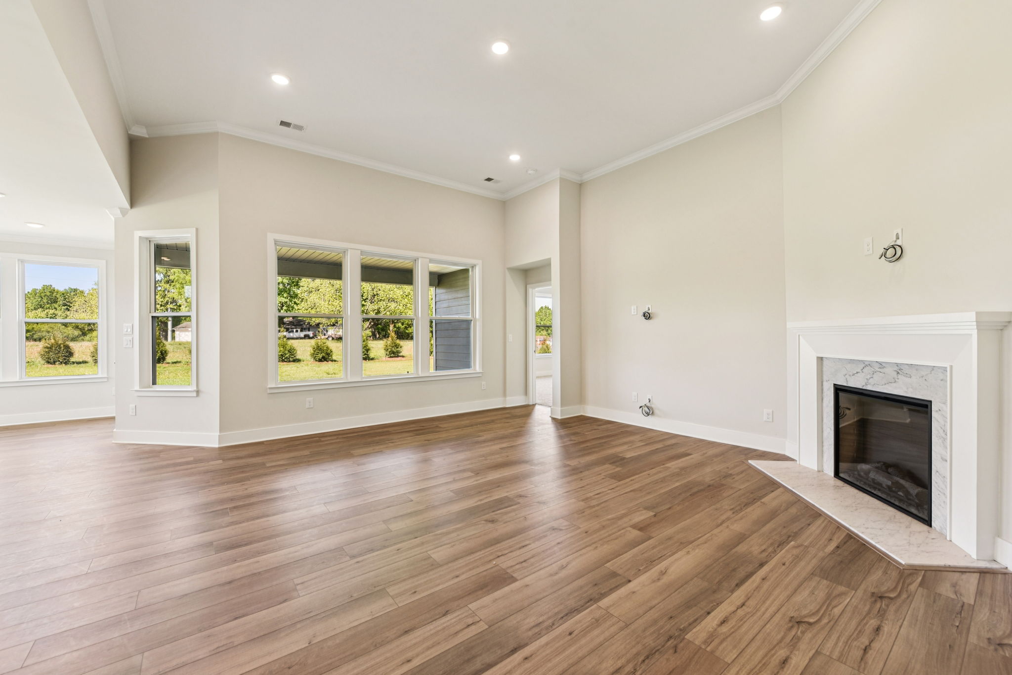 A large room with a fireplace.