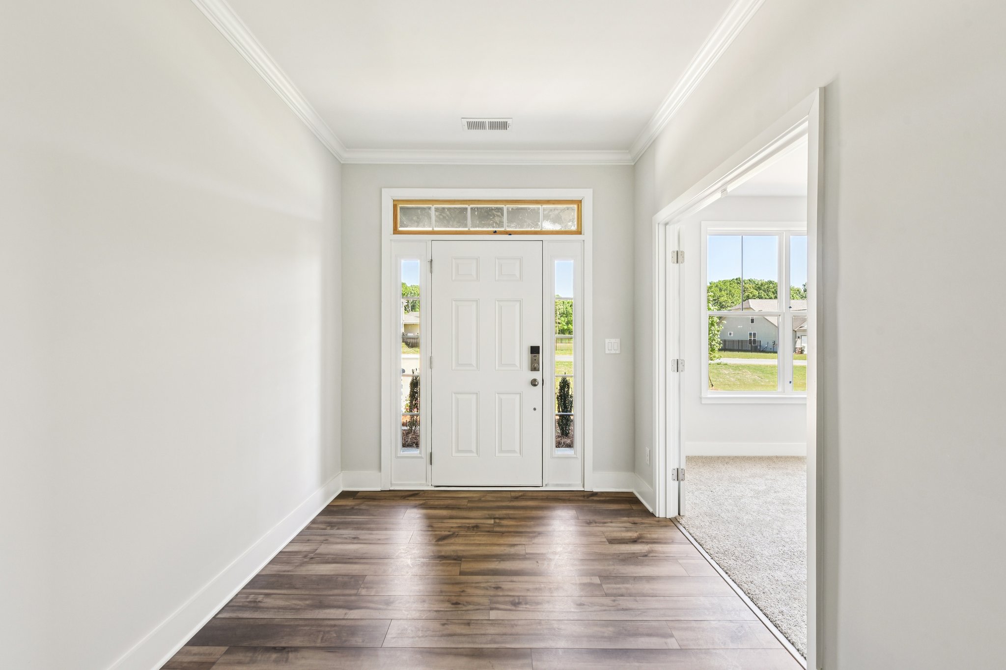 A hallway with white doors.