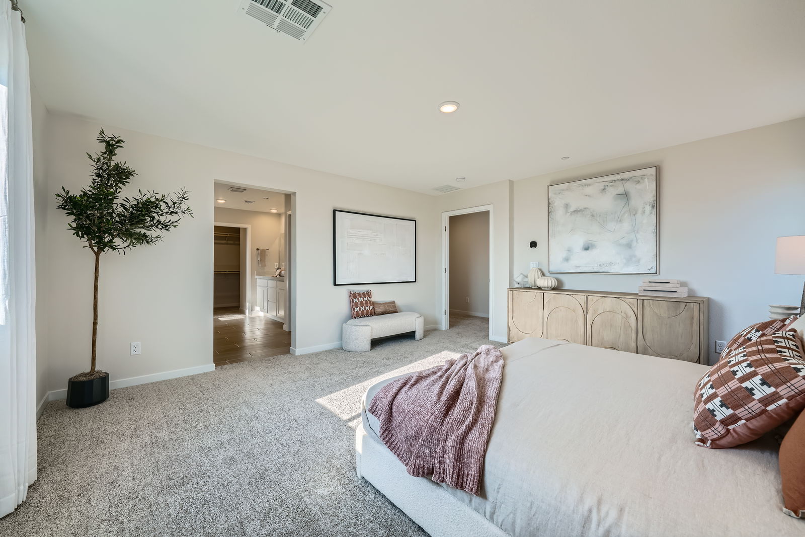 A bedroom with a bed and a couch.