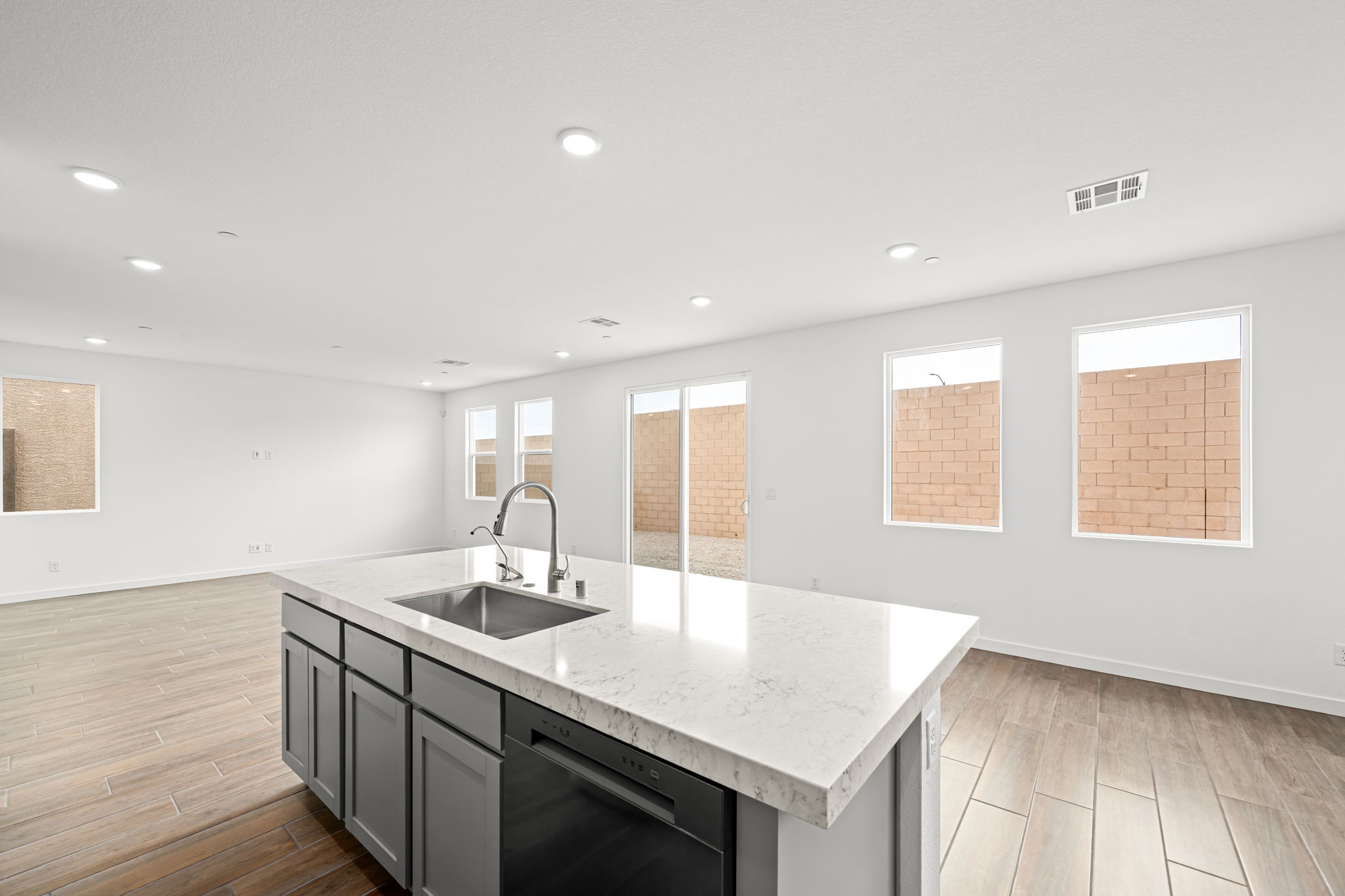 A kitchen with a marble countertop.