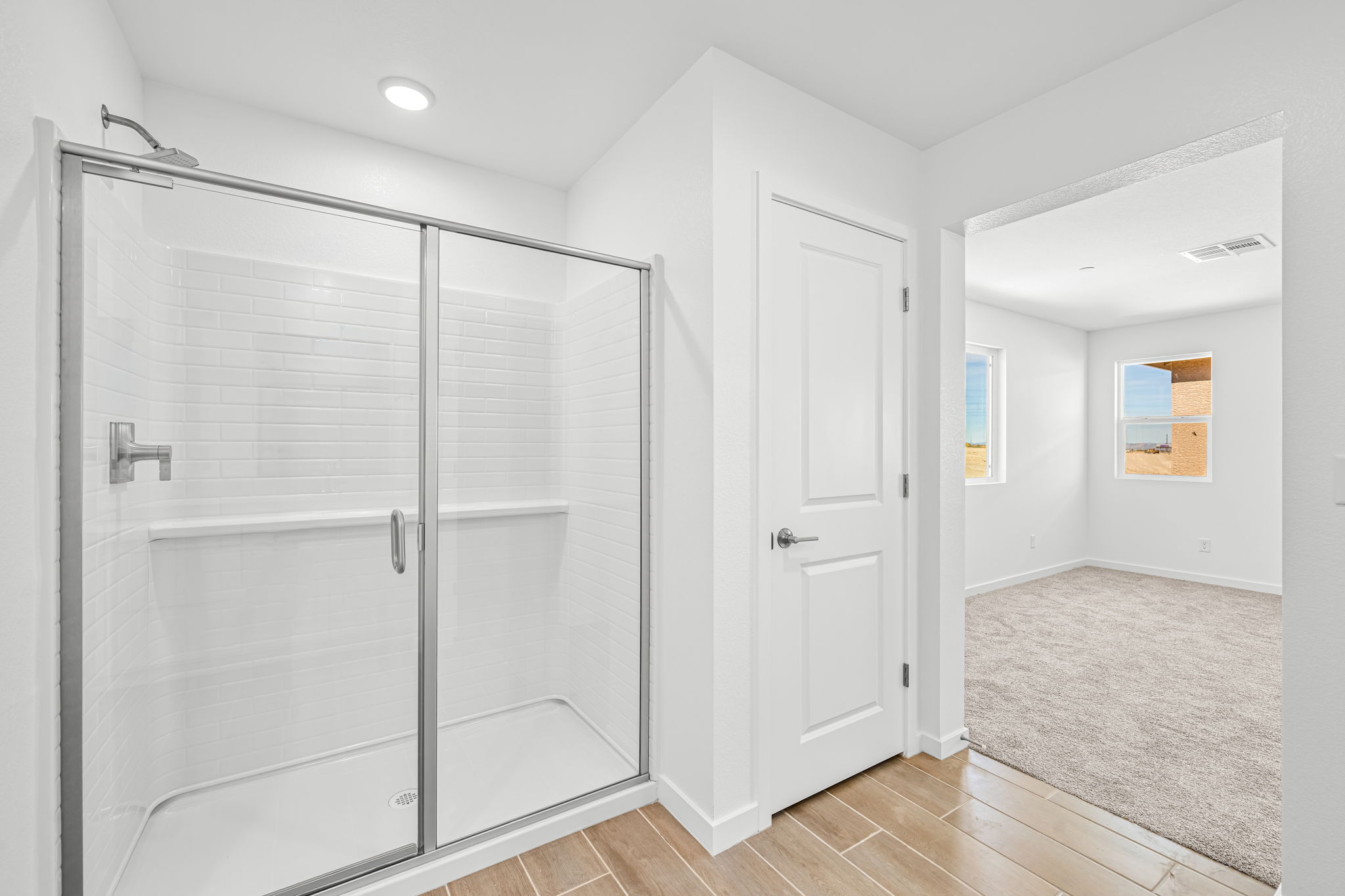 A bathroom with a glass shower.