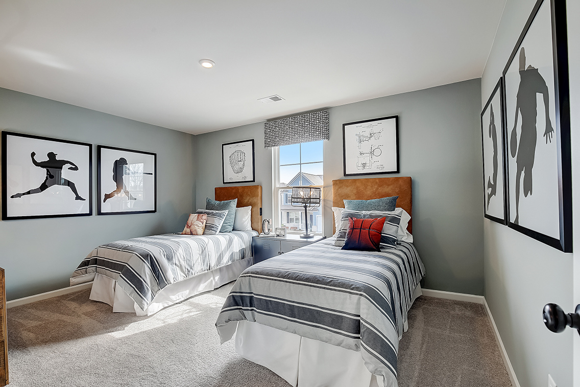 A bedroom with two beds.