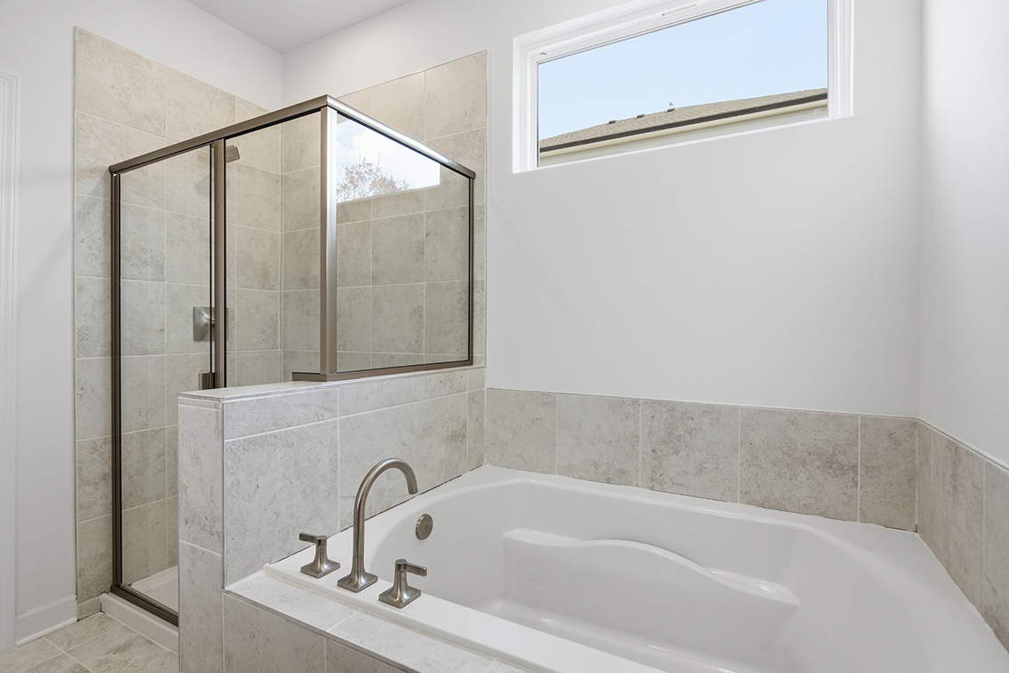A bathroom with a glass shower.