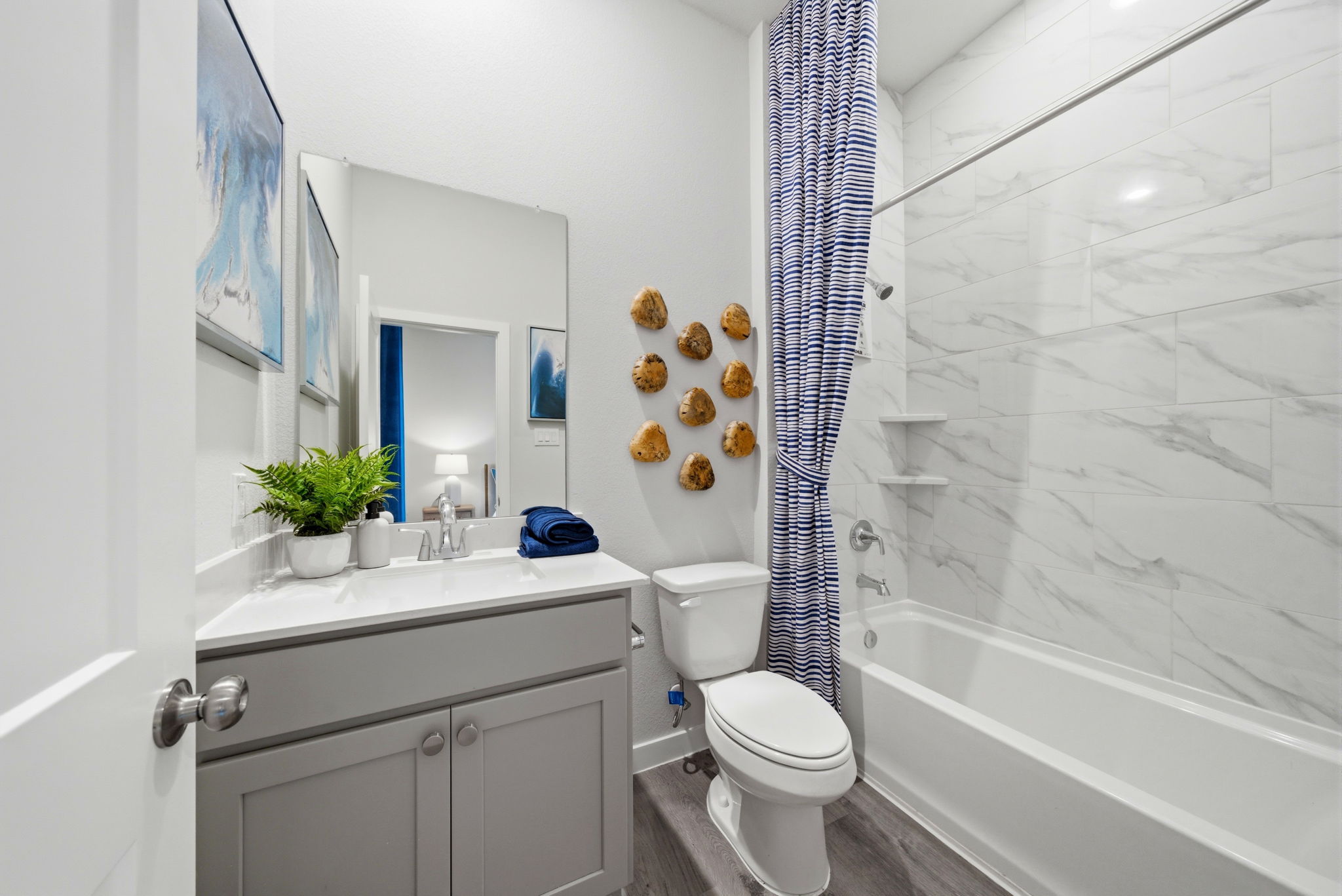 A bathroom with a shower and toilet.