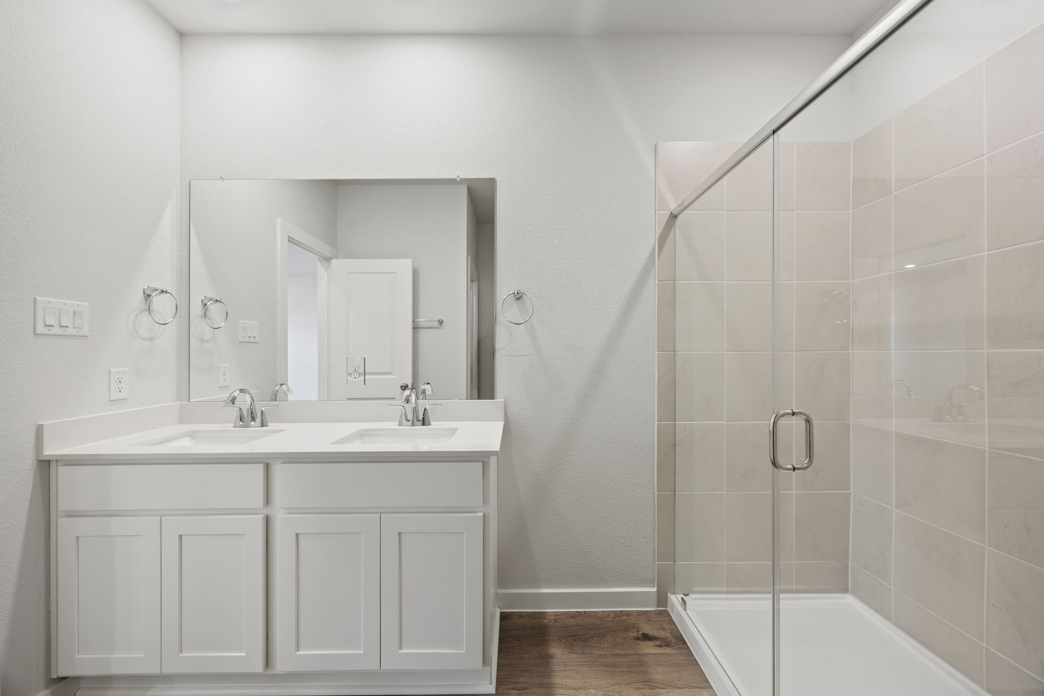 A bathroom with a glass shower.