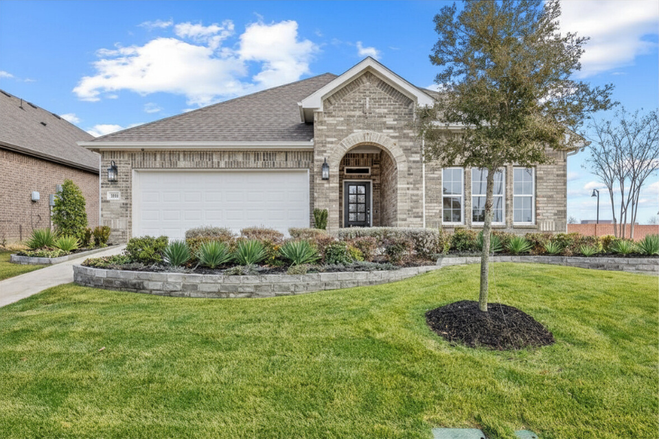 A house with a large front yard.