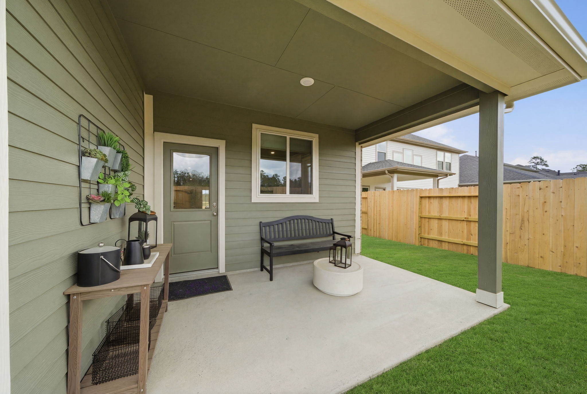 A house with a bench and a table.
