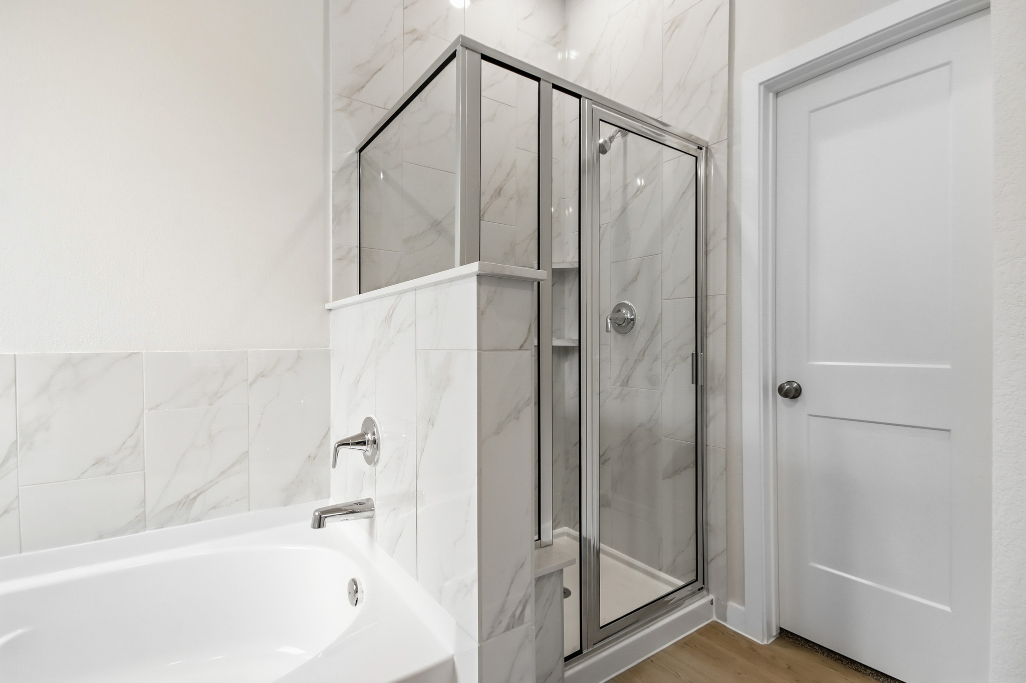 A bathroom with a glass shower.