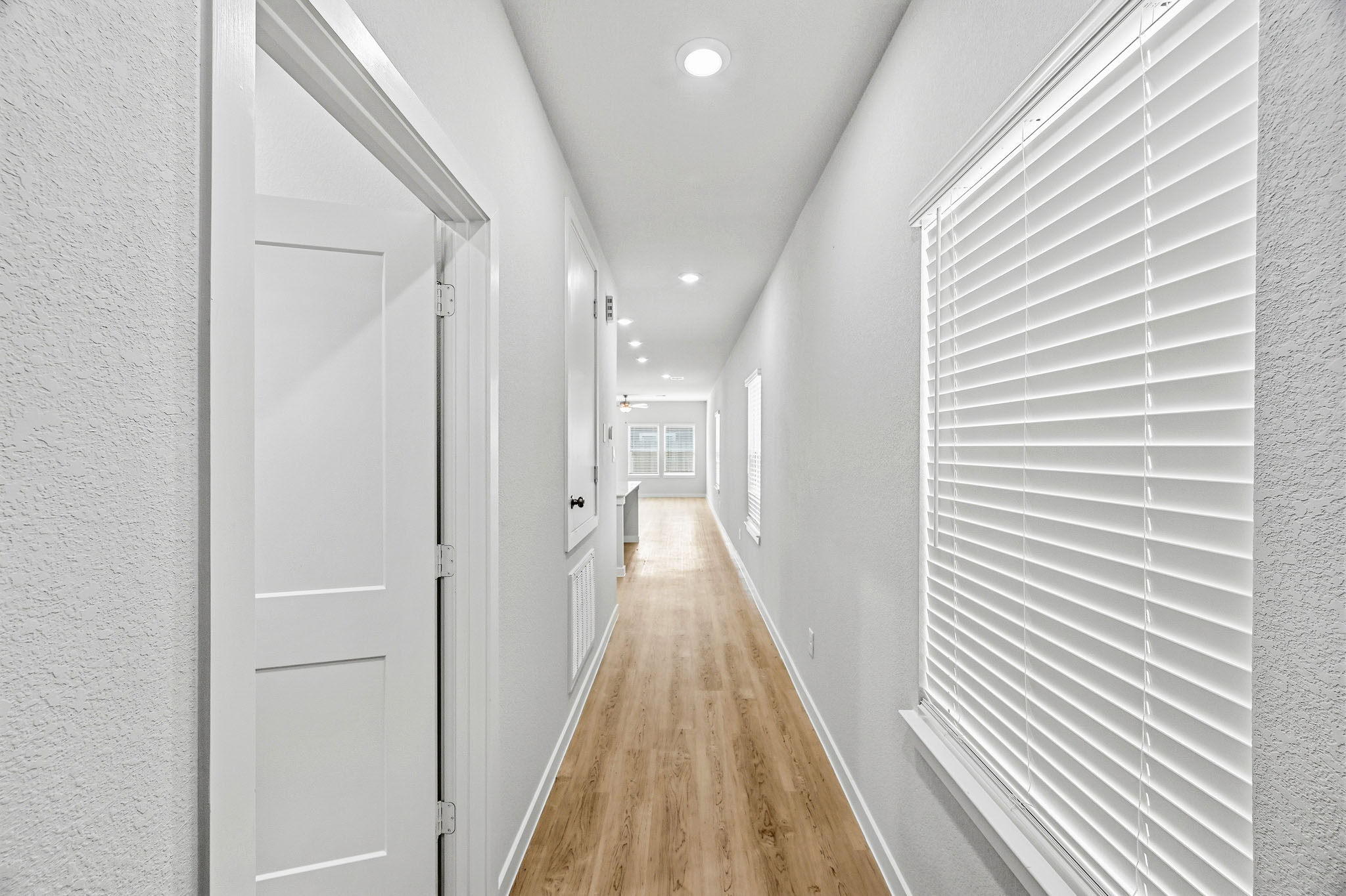 A hallway with white doors.