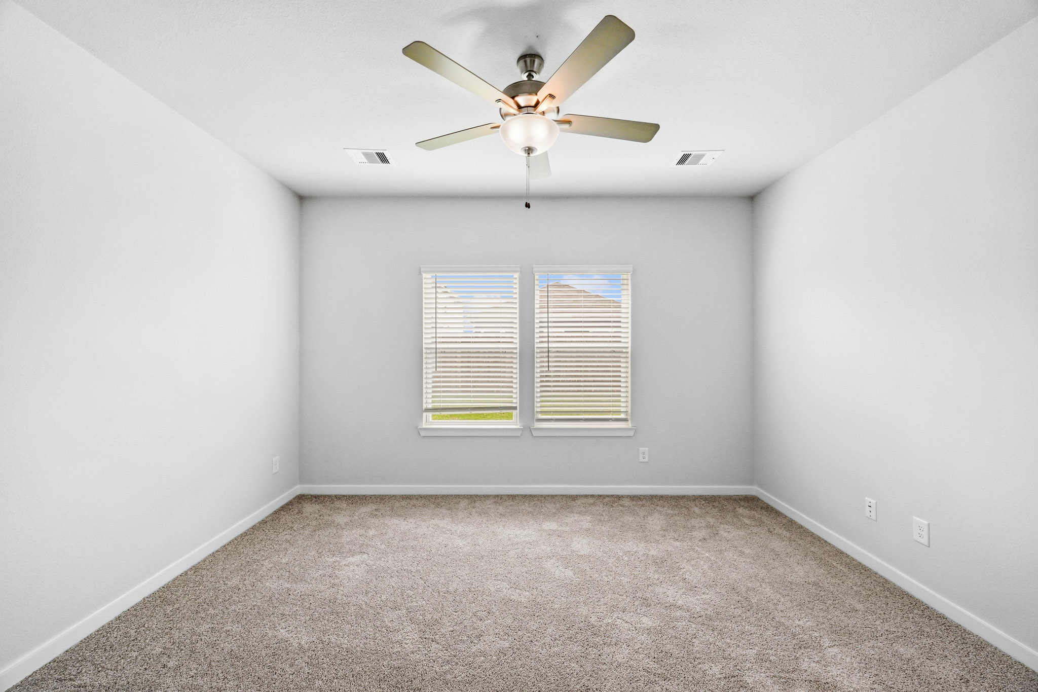A ceiling fan in a room.