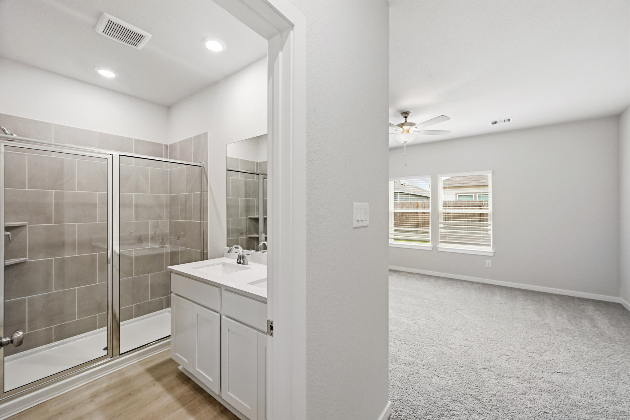 A bathroom with a glass shower.