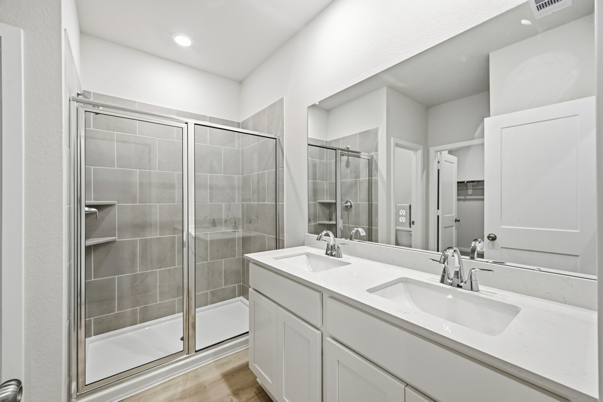 A bathroom with a glass shower.