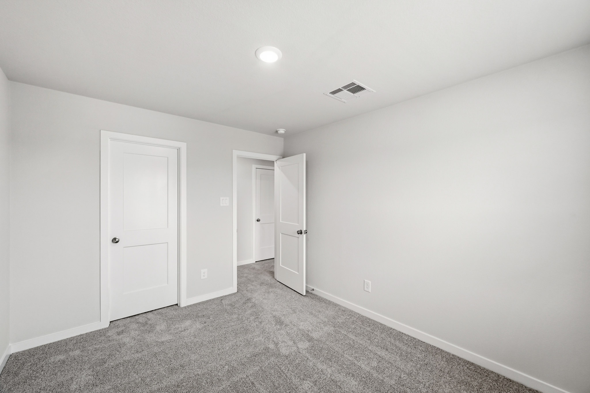 A room with white doors.