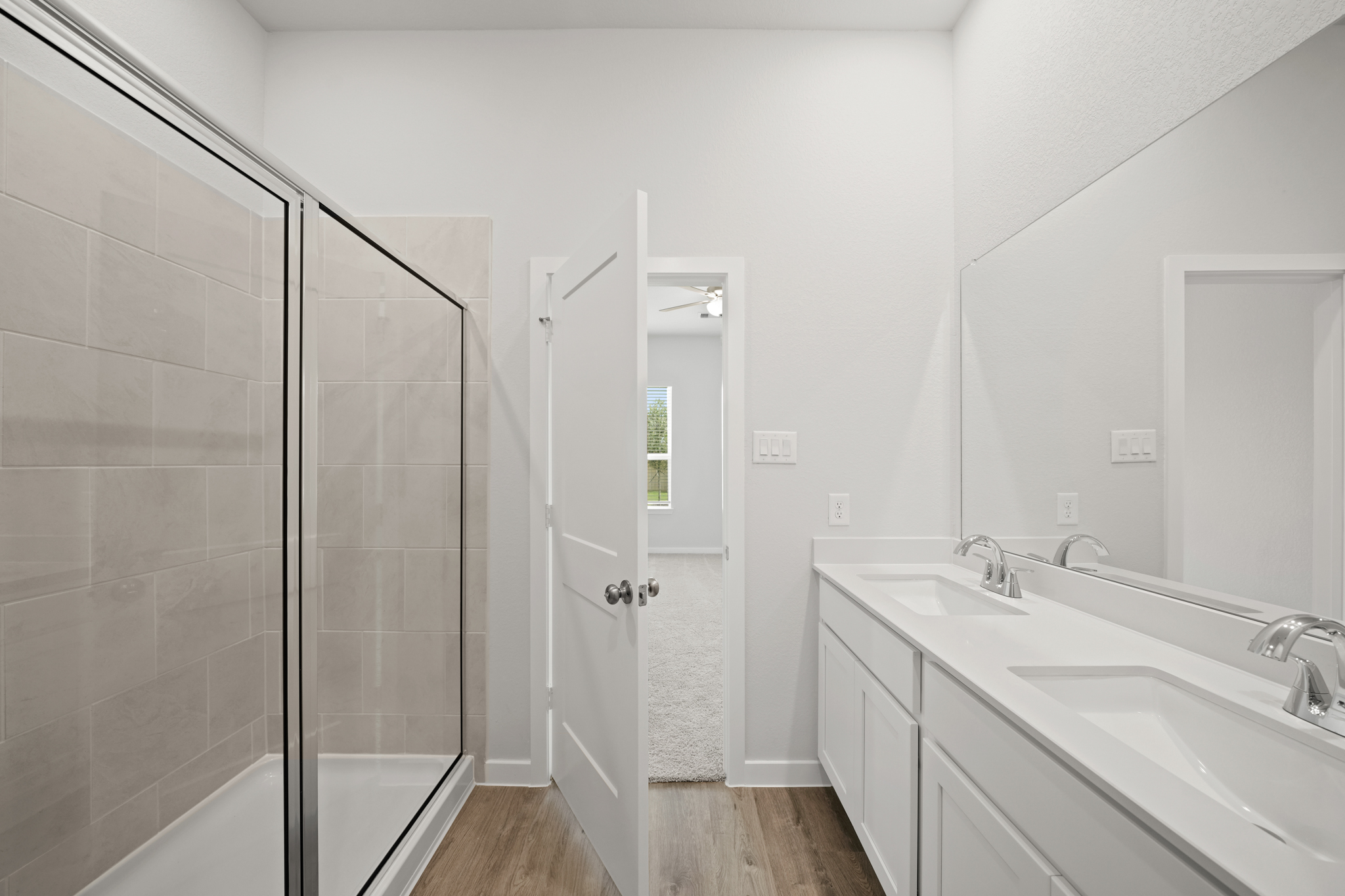A bathroom with a glass shower.