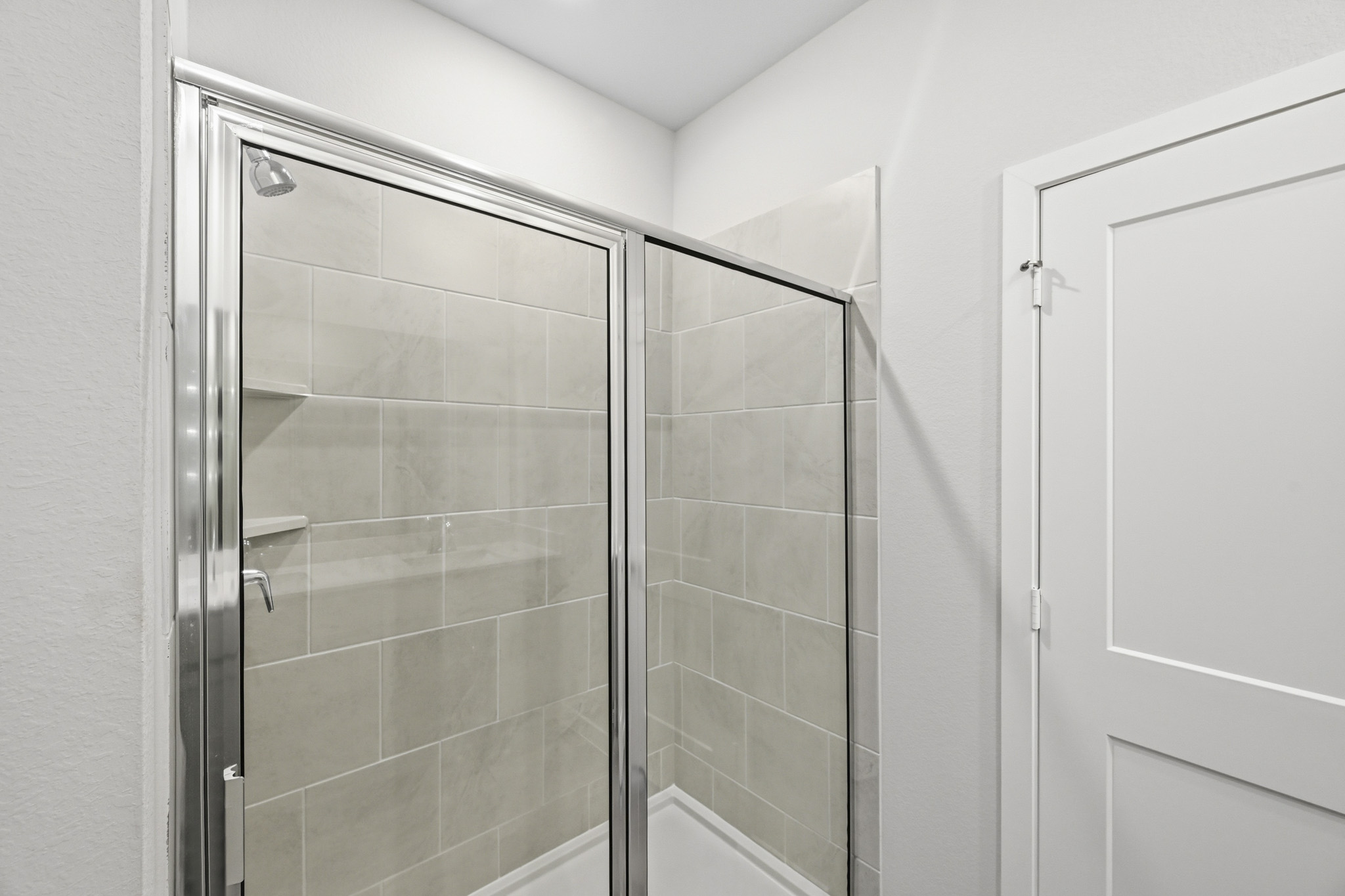 A shower unit in a bathroom.