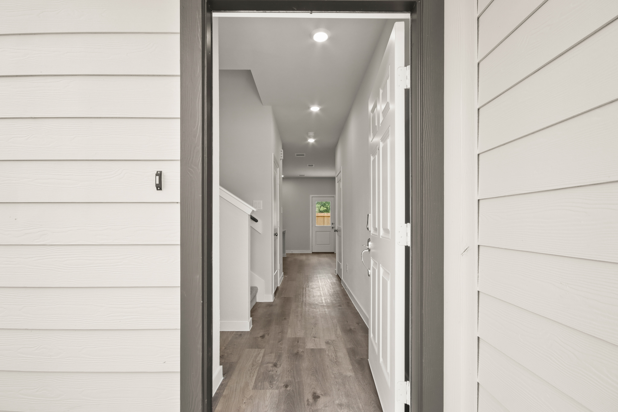 A hallway with white walls.