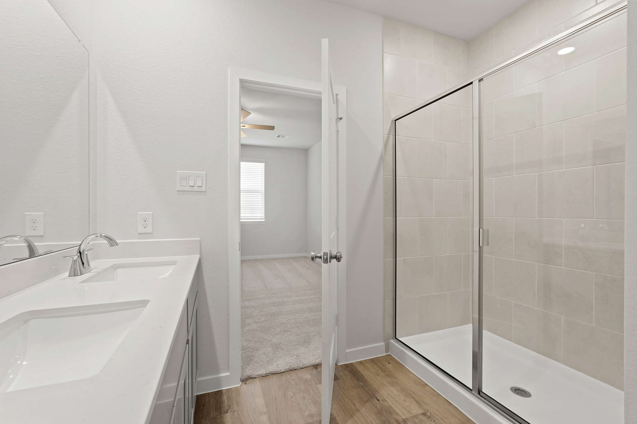 A bathroom with a glass shower.