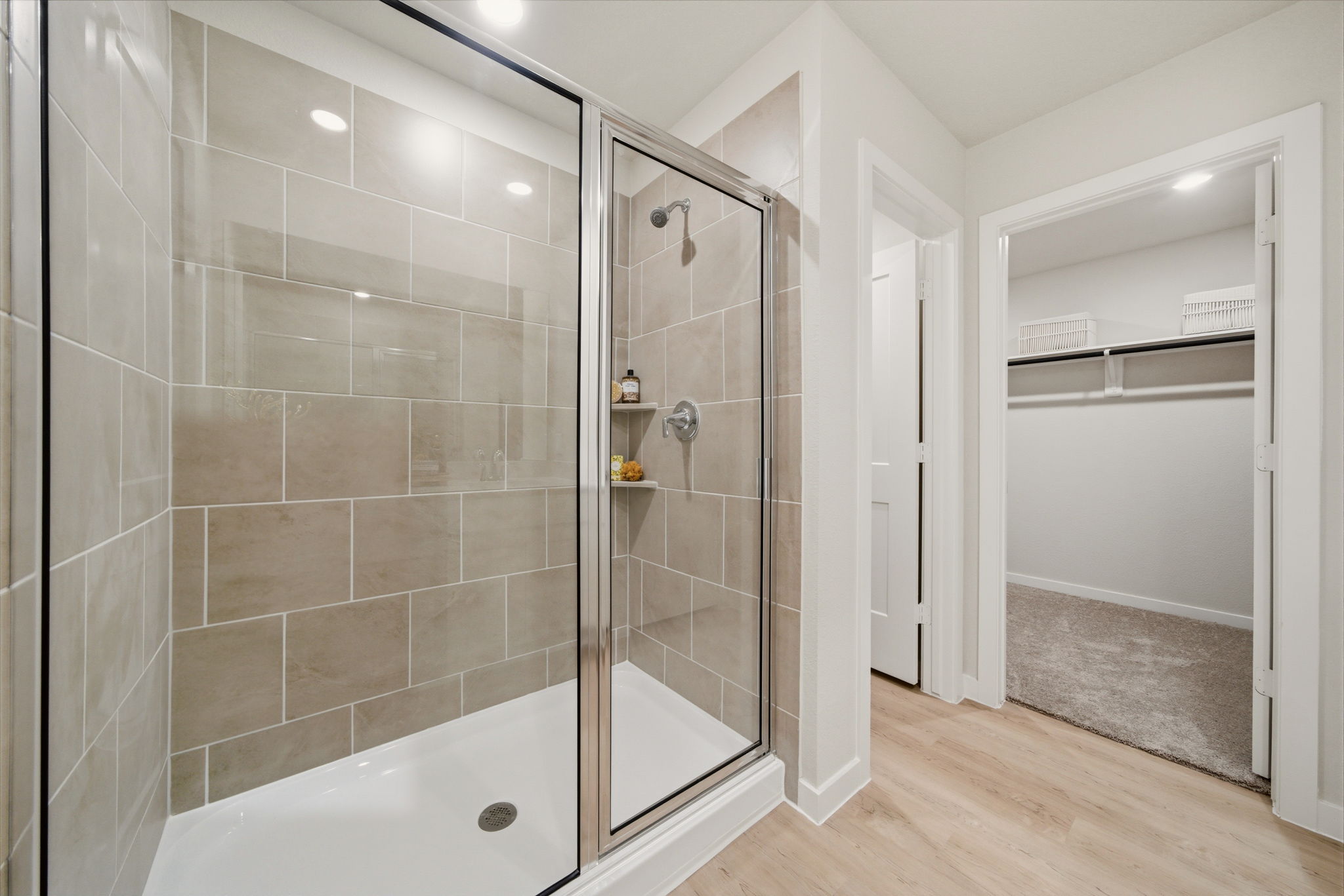 A bathroom with a glass shower.