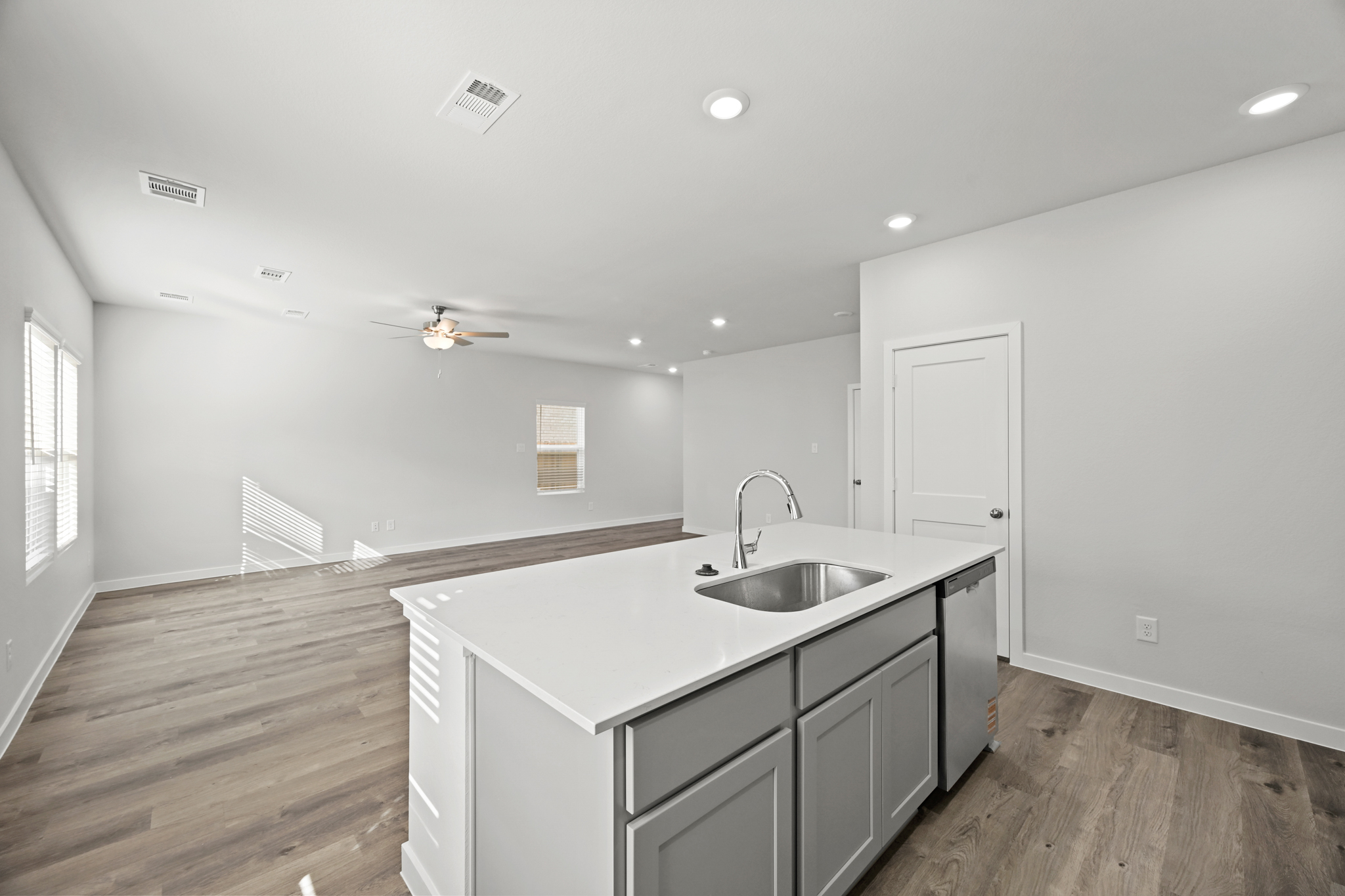 A kitchen with a sink and a counter top.